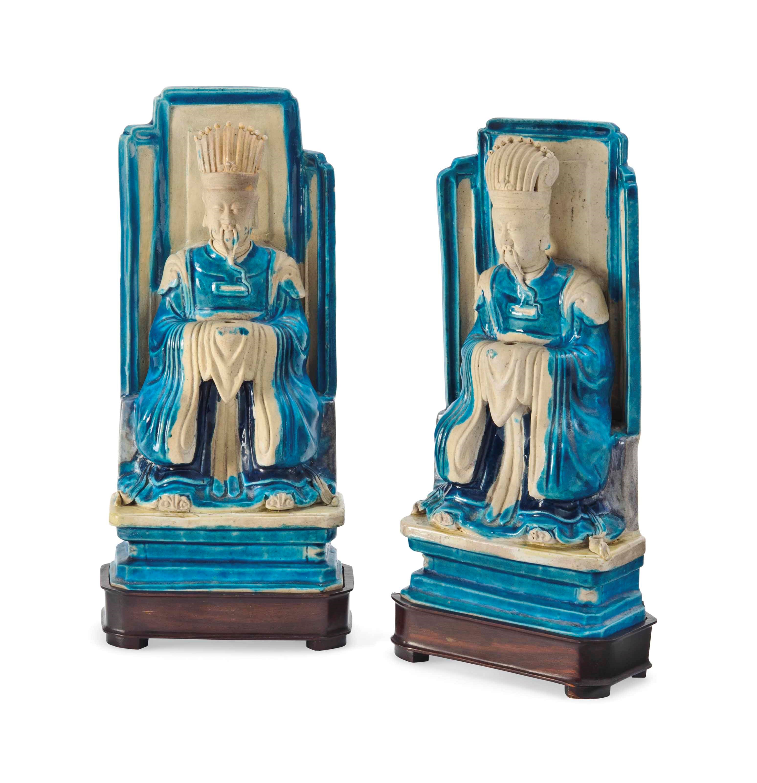 A PAIR OF CHINESE GLAZED BISCUIT DAOIST FIGURES