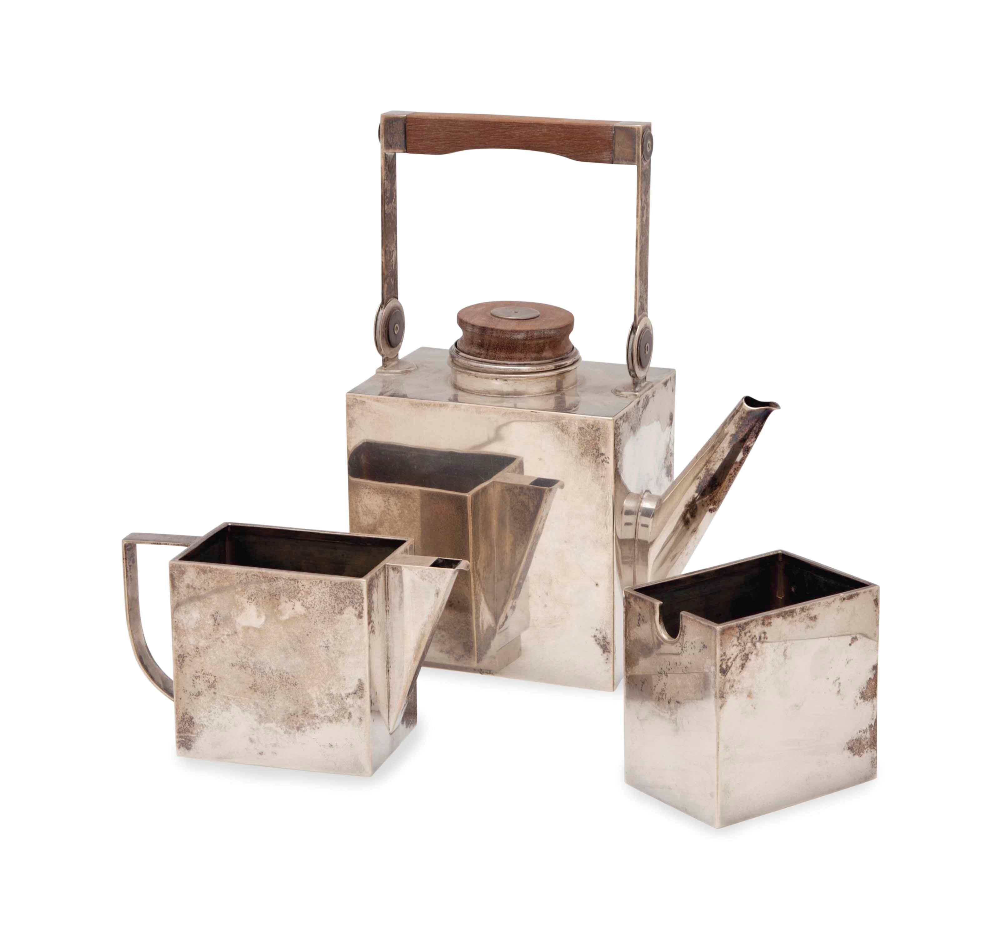 A CONTINENTAL SILVER THREE-PIECE TEA SERVICE,