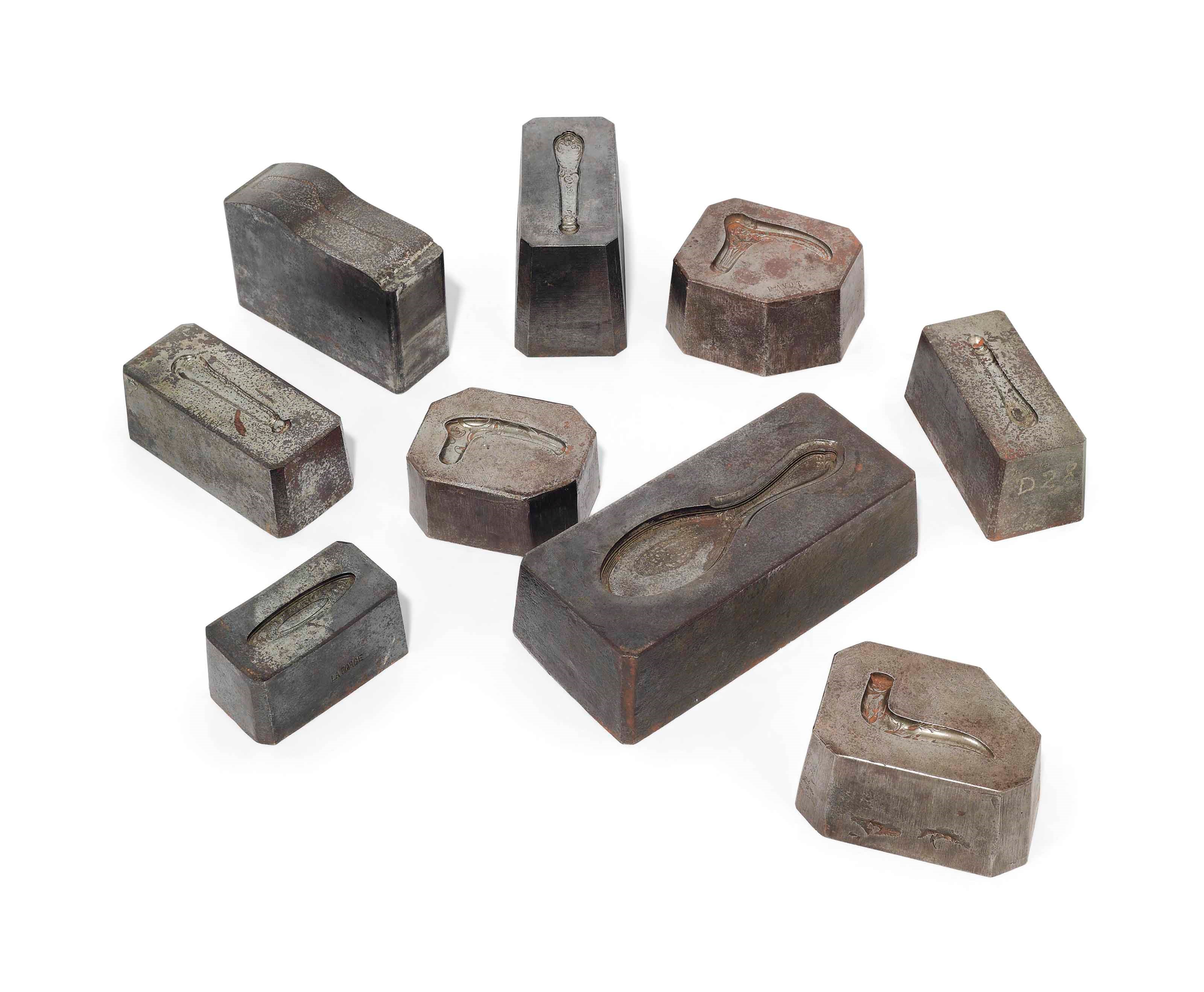 A GROUP OF NINE FRENCH IRON SILVERSMITH'S EMBOSSING DIES