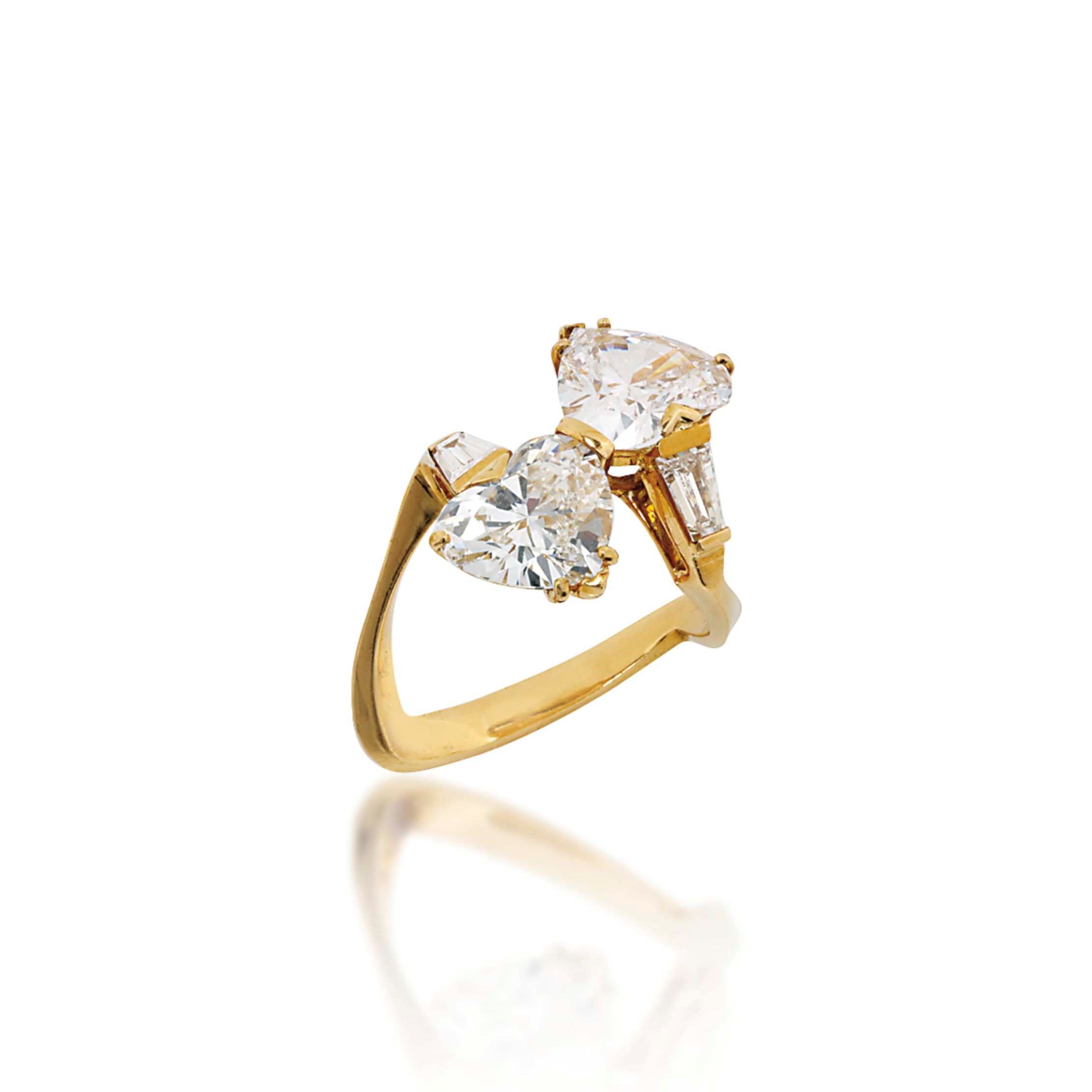 A DIAMOND CROSS-OVER RING