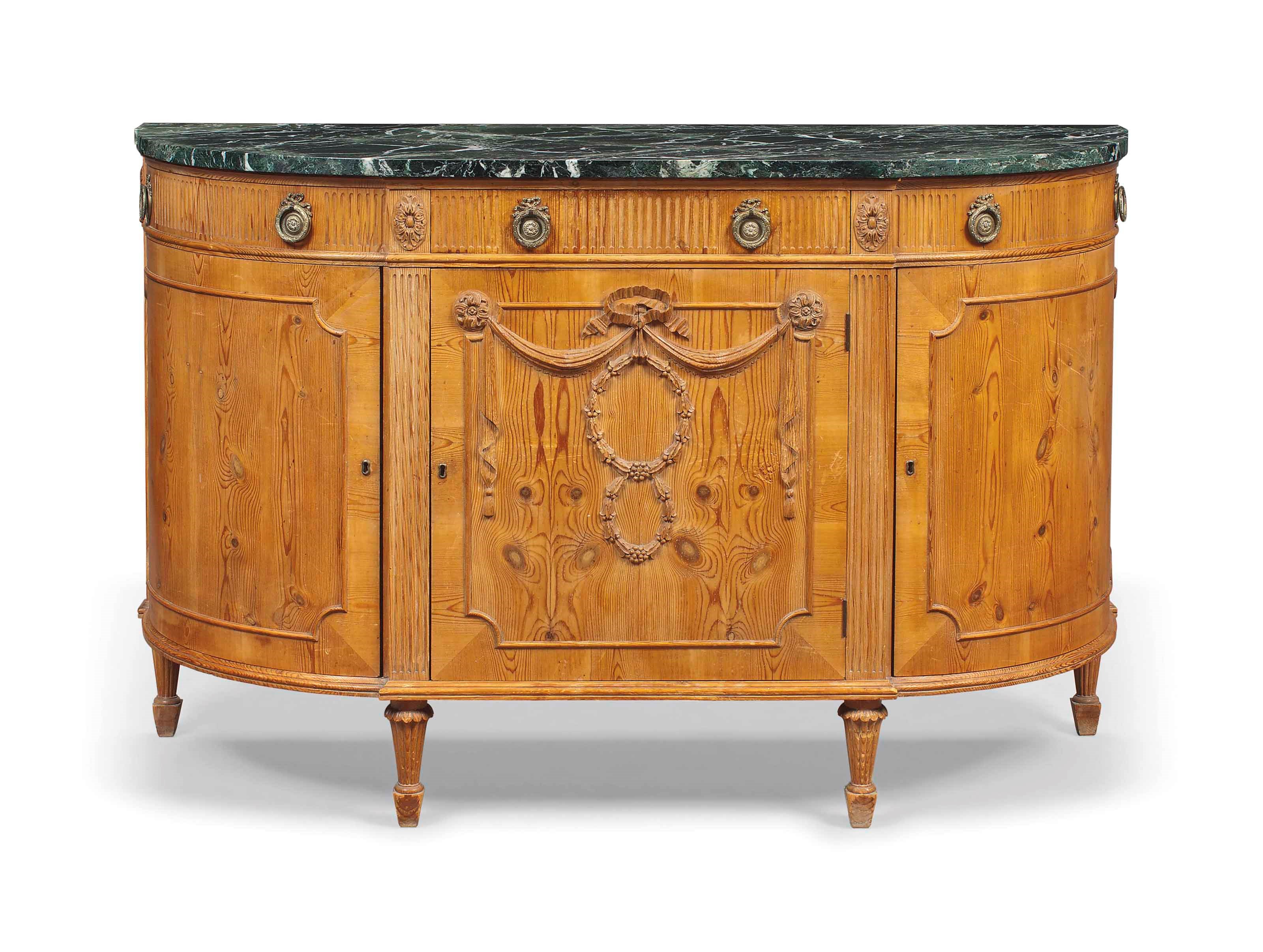 A FRENCH PINE DEMI-LUNE COMMODE