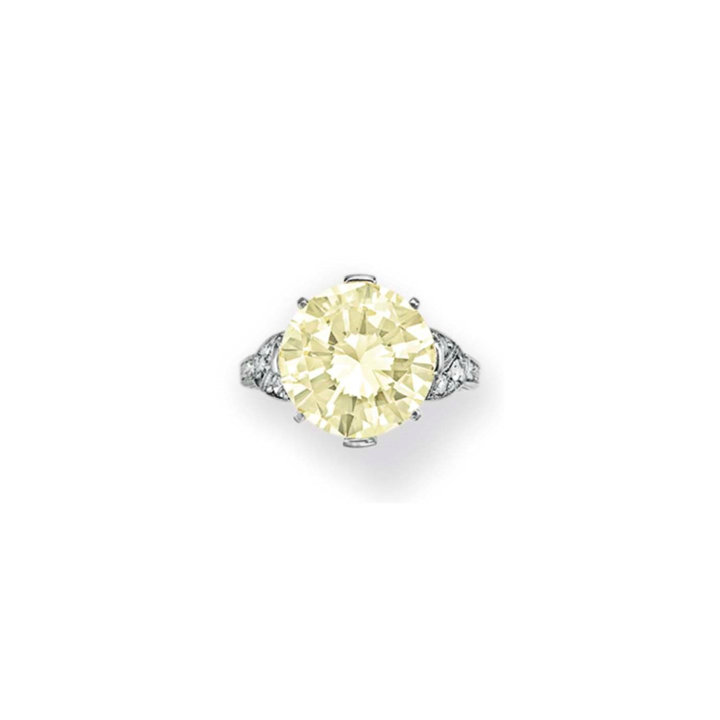 A COLORED DIAMOND AND DIAMOND RING