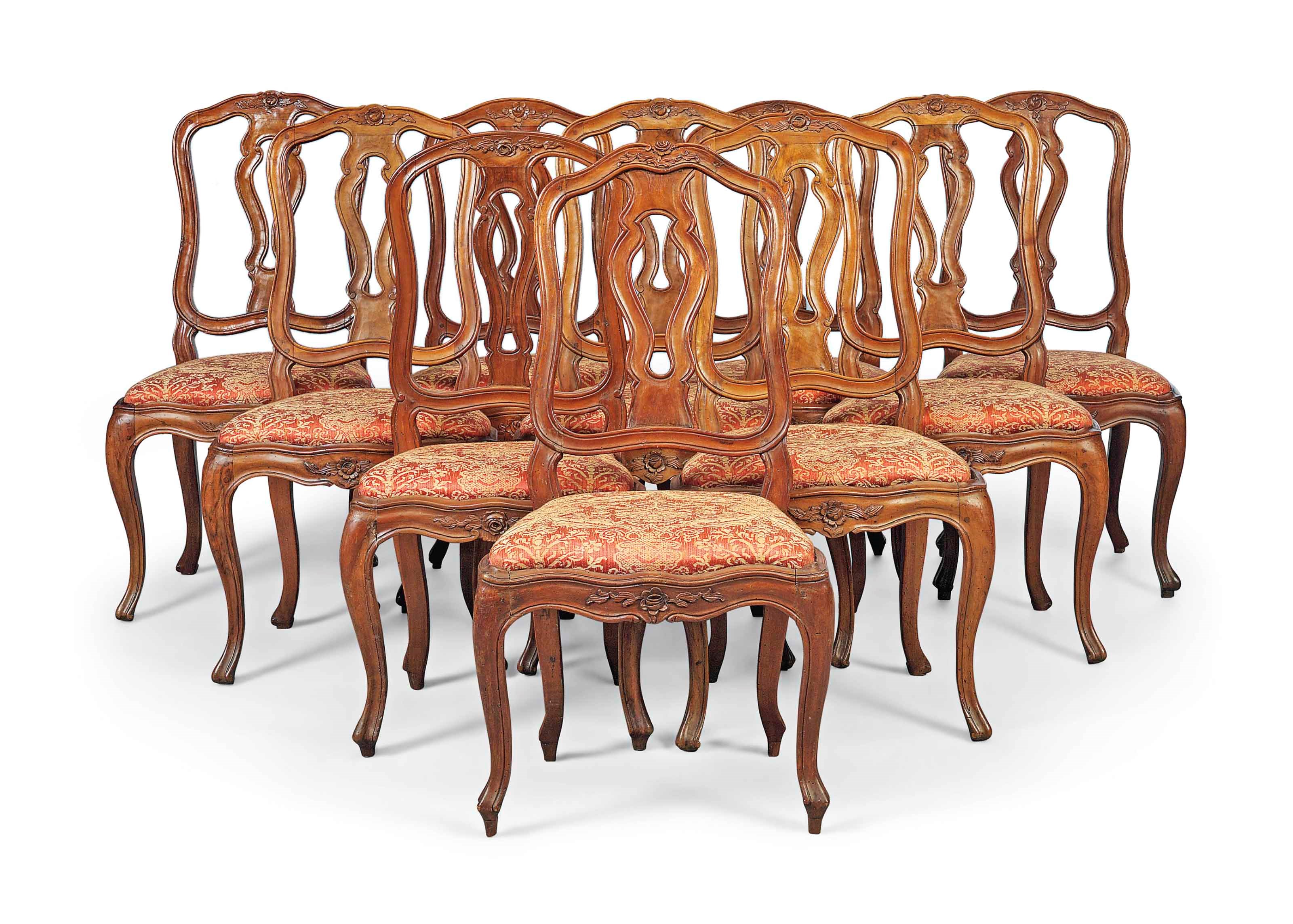 A NEAR SET OF TEN NORTH ITALIAN WALNUT DINING-CHAIRS