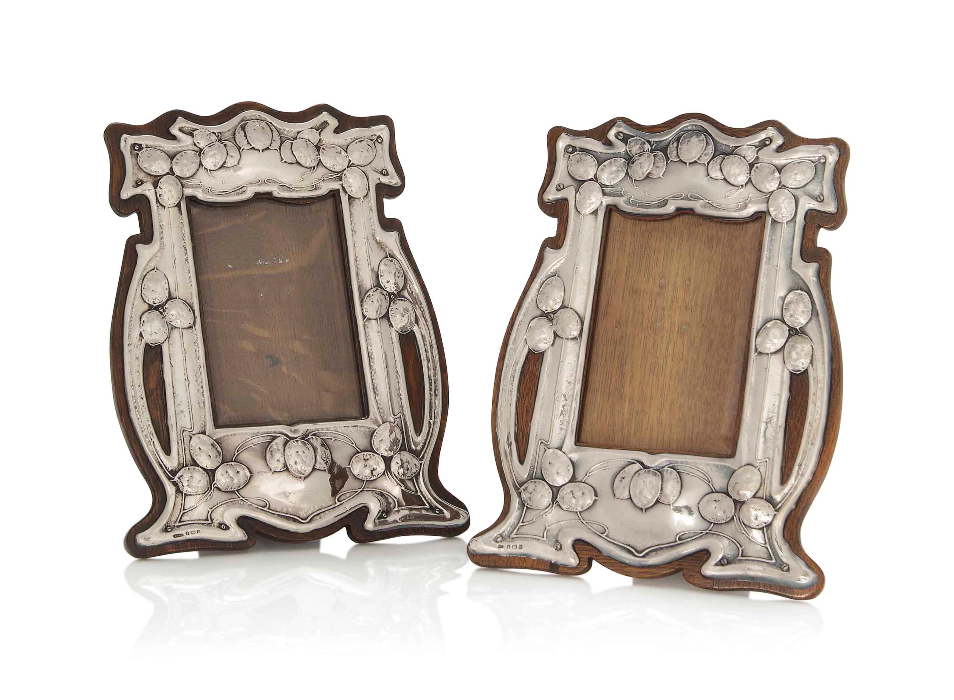 A MATCHED PAIR OF SILVER AND OAK PHOTOGRAPH FRAMES