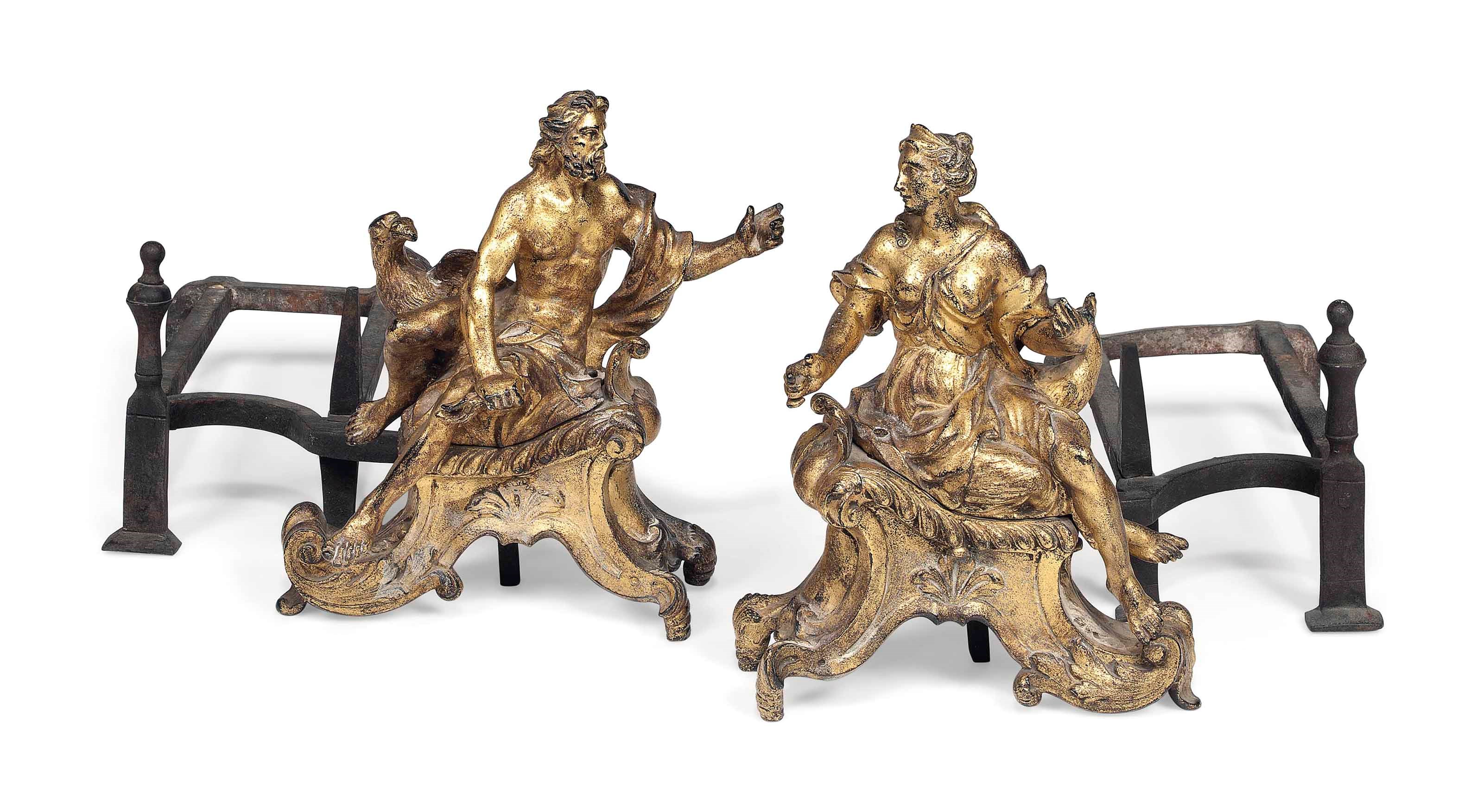 A PAIR OF FRENCH GILT-IRON CHENETS