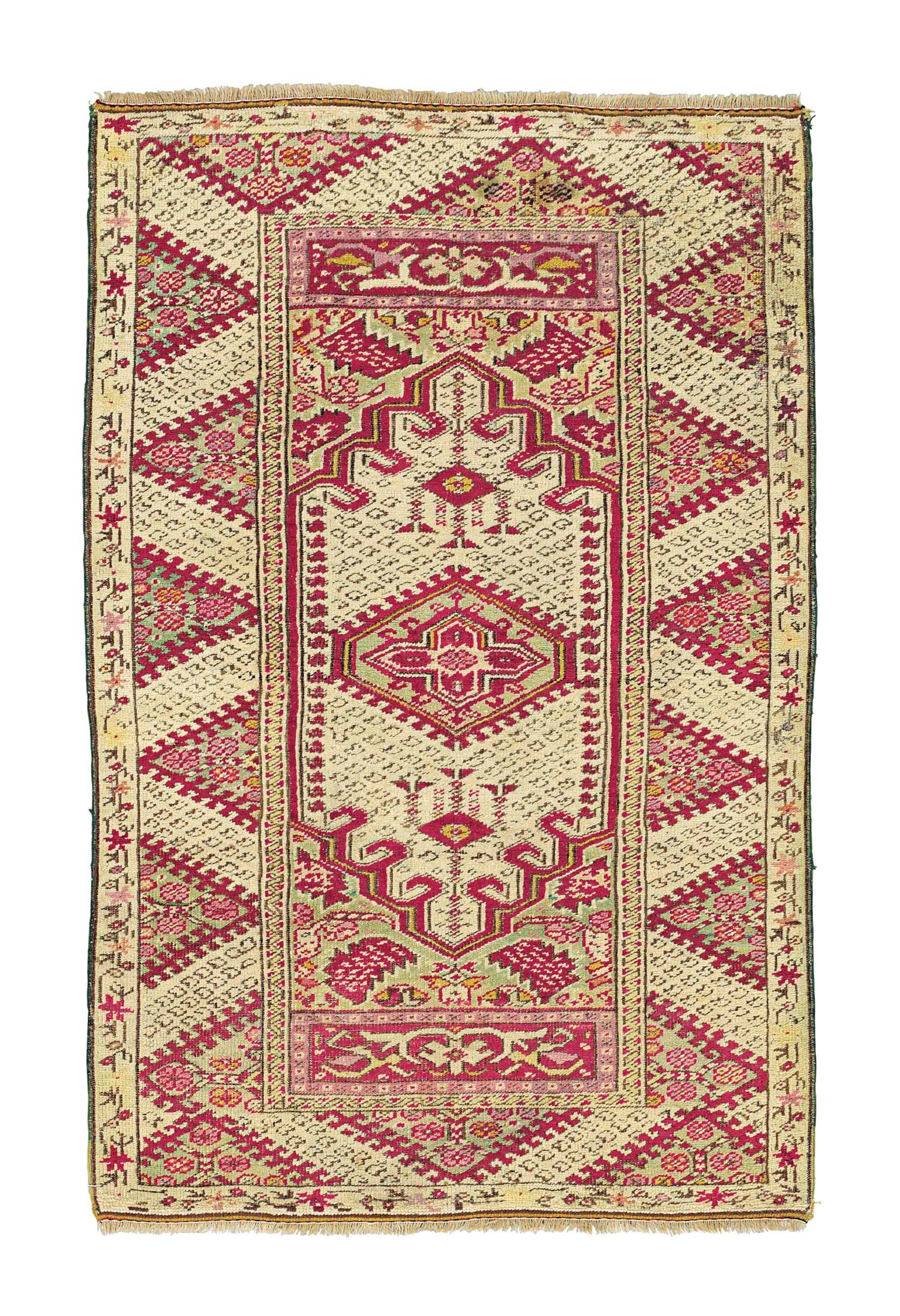 An antique Ghiordes rug