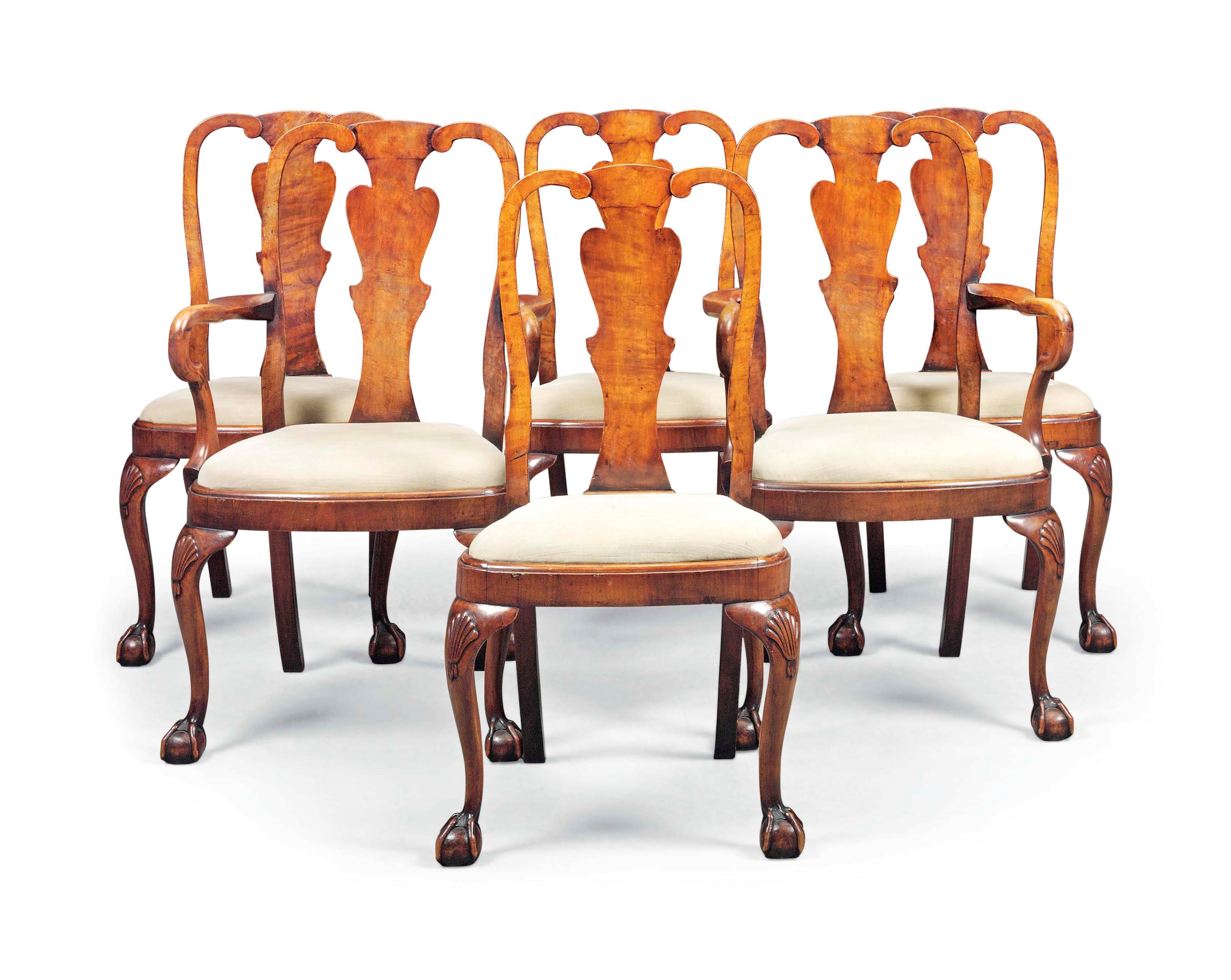A SET OF SIX WALNUT DINING CHAIRS