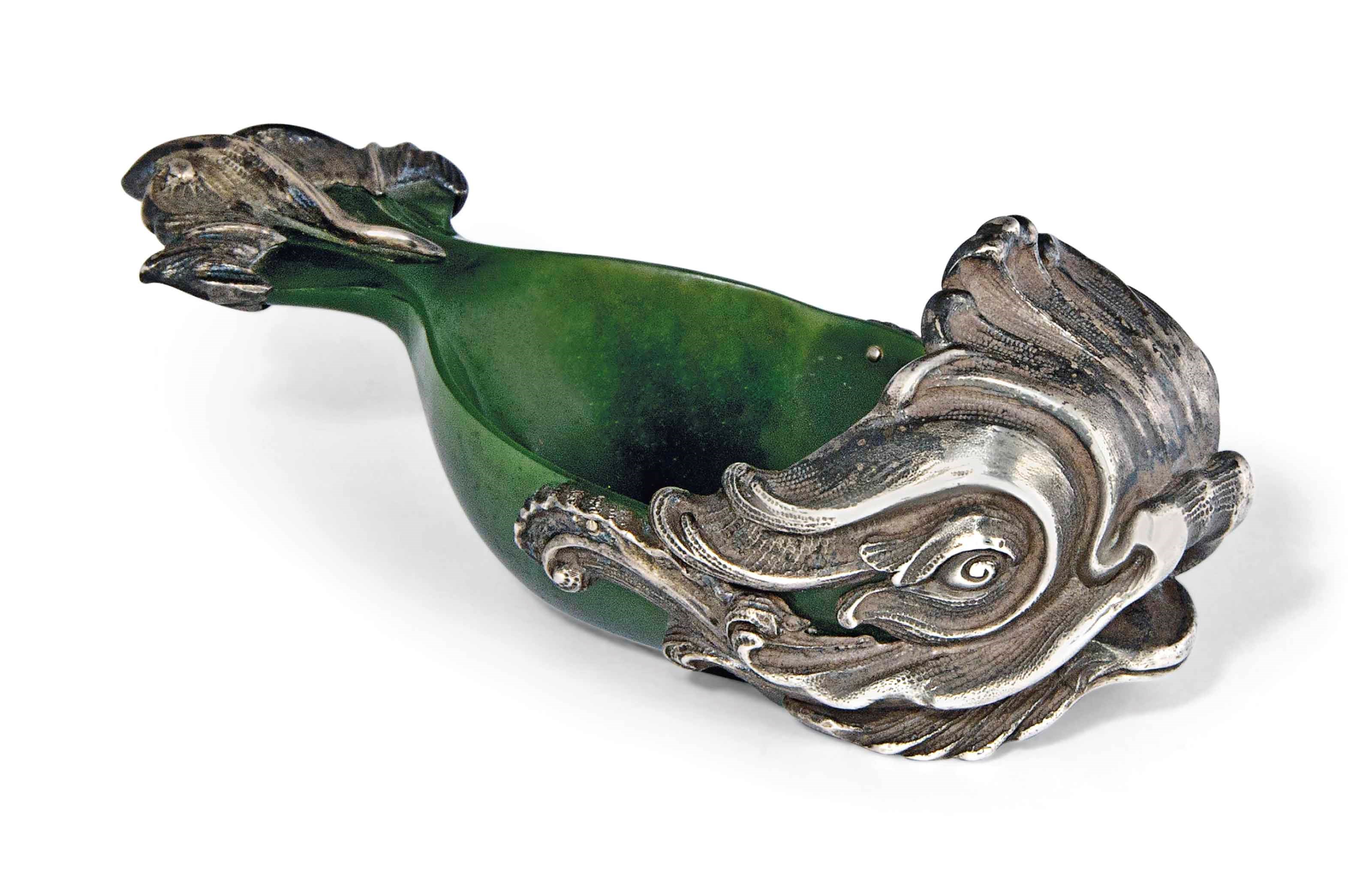 A SILVER-MOUNTED NEPHRITE KOVSH MODELLED AS A DOLPHIN IN STYLE OF FABERGÉ