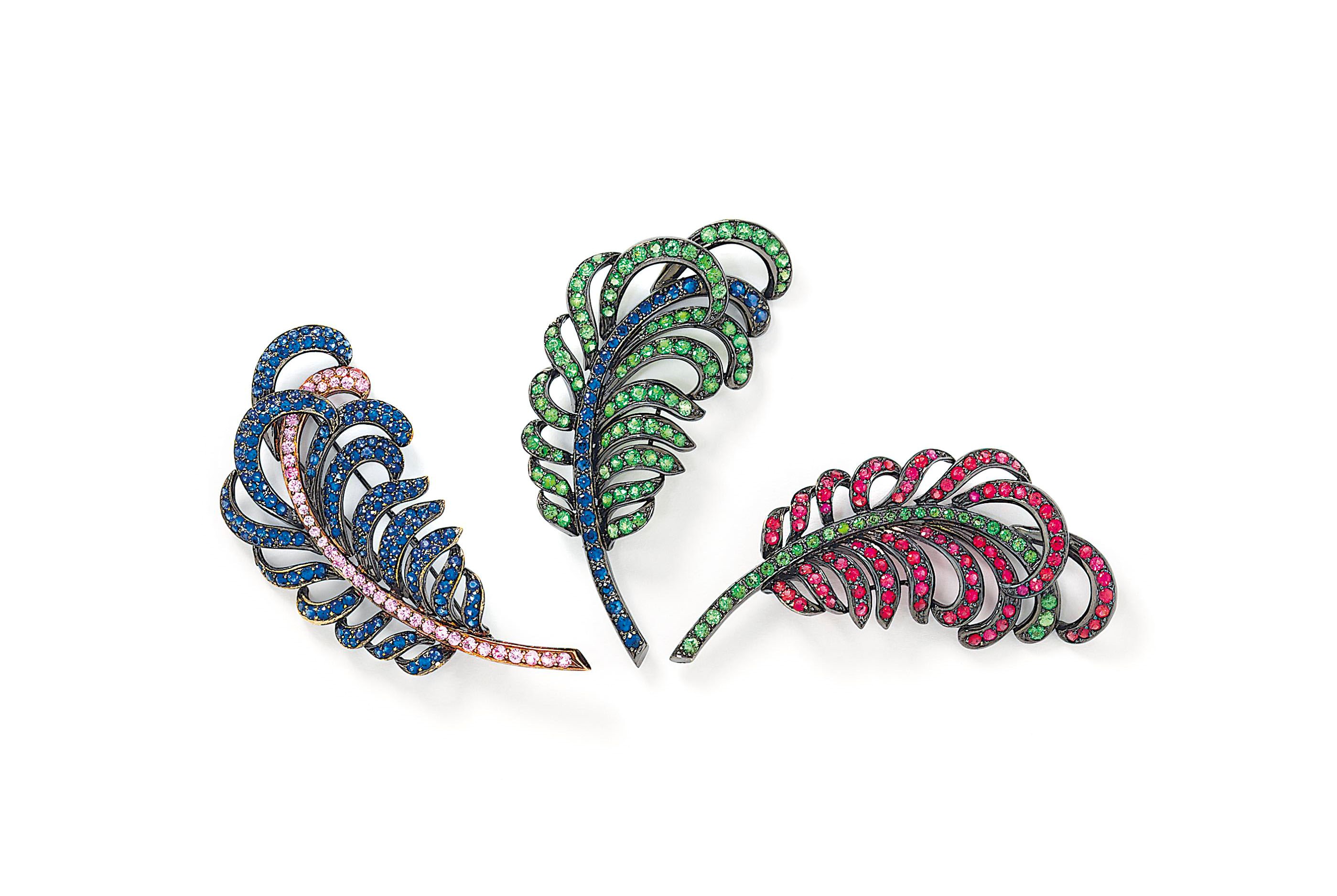 Three gem-set brooches