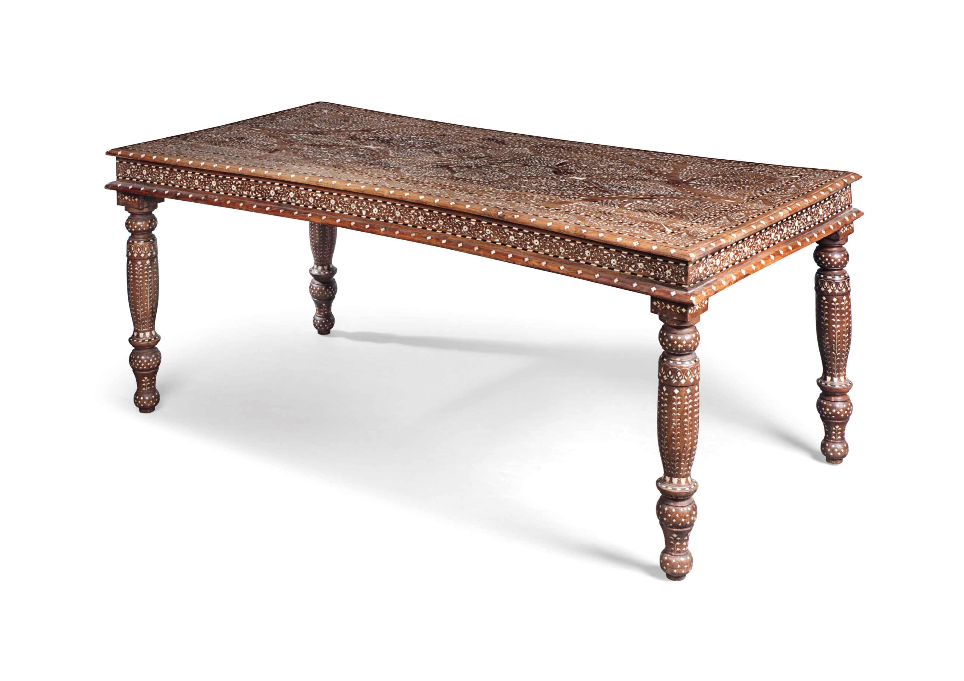 AN INDIAN EBONY AND BONE-INLAID TEAK DINING TABLE