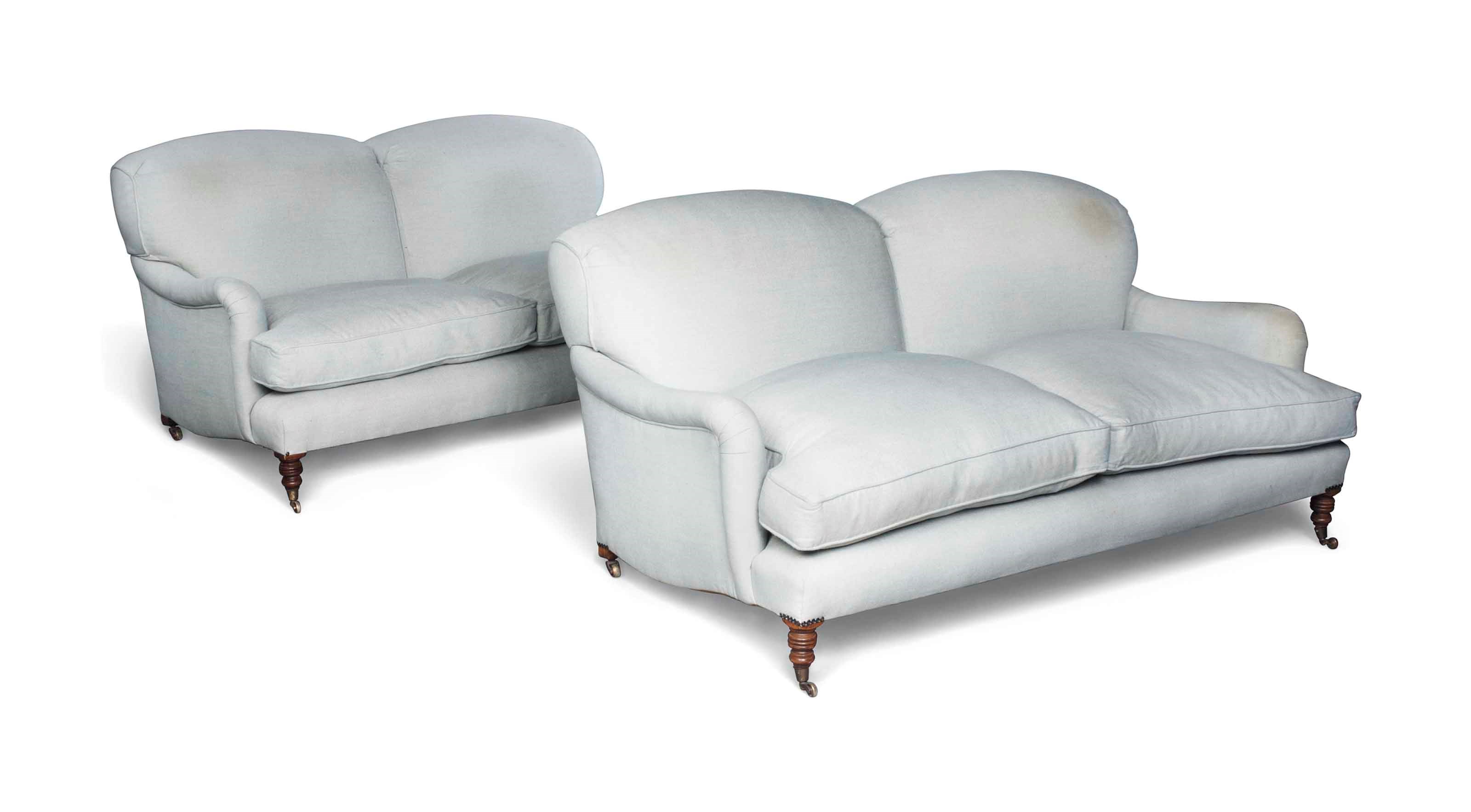 A PAIR OF LARGE BEECH TWO-SEATER SOFAS