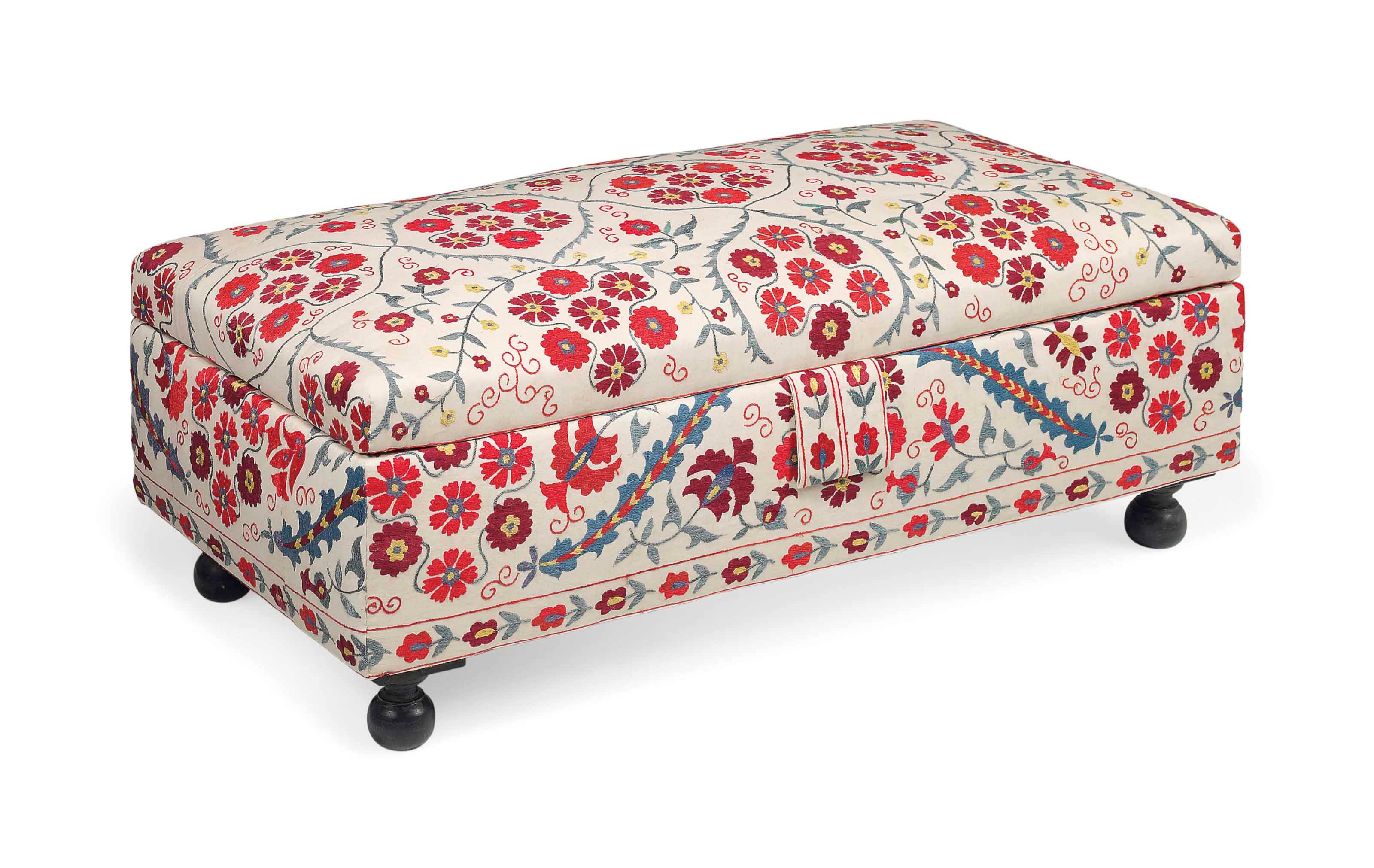 A SUSANI UPHOLSTERED OTTOMAN STOOL