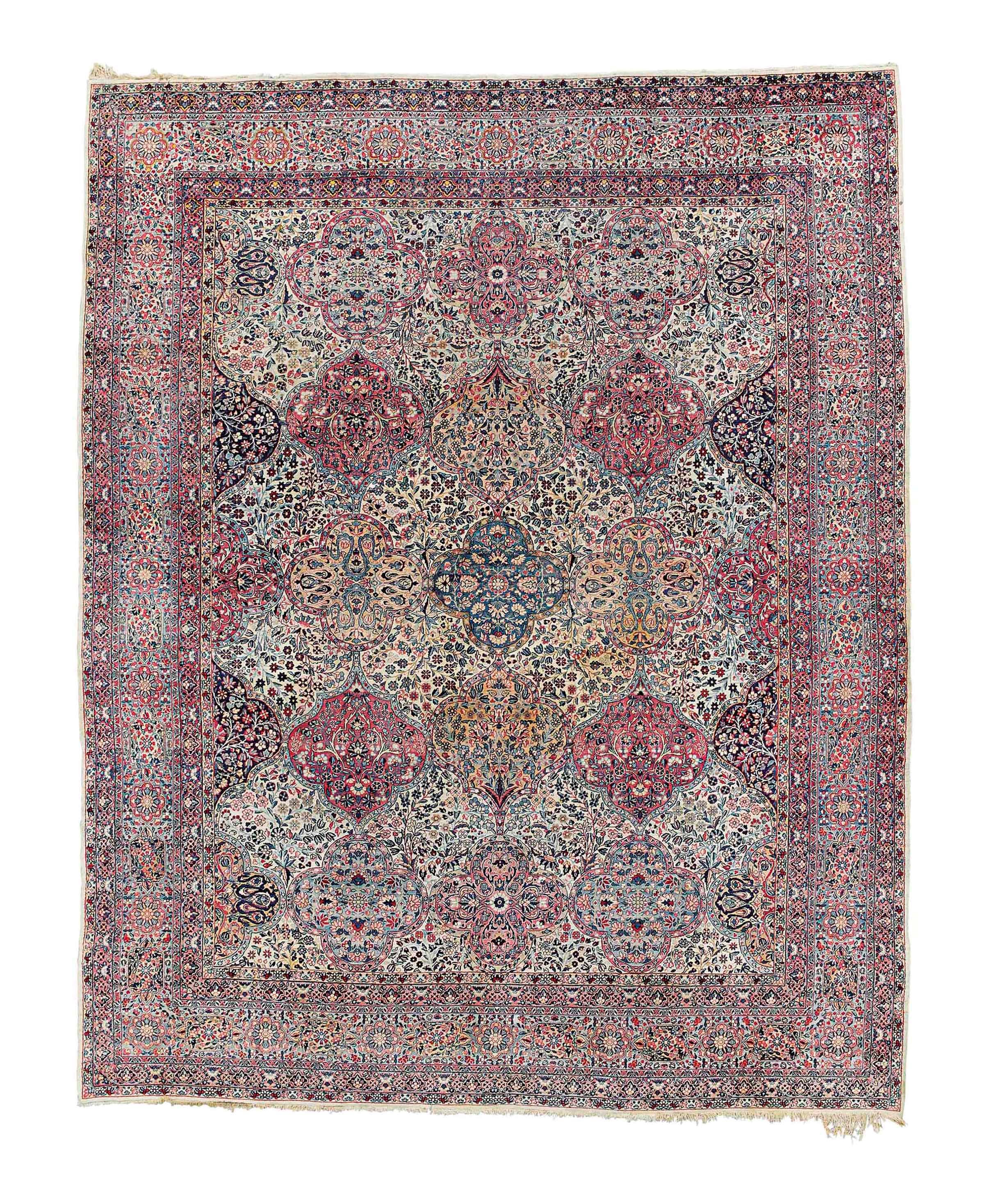 An antique Kirman carpet