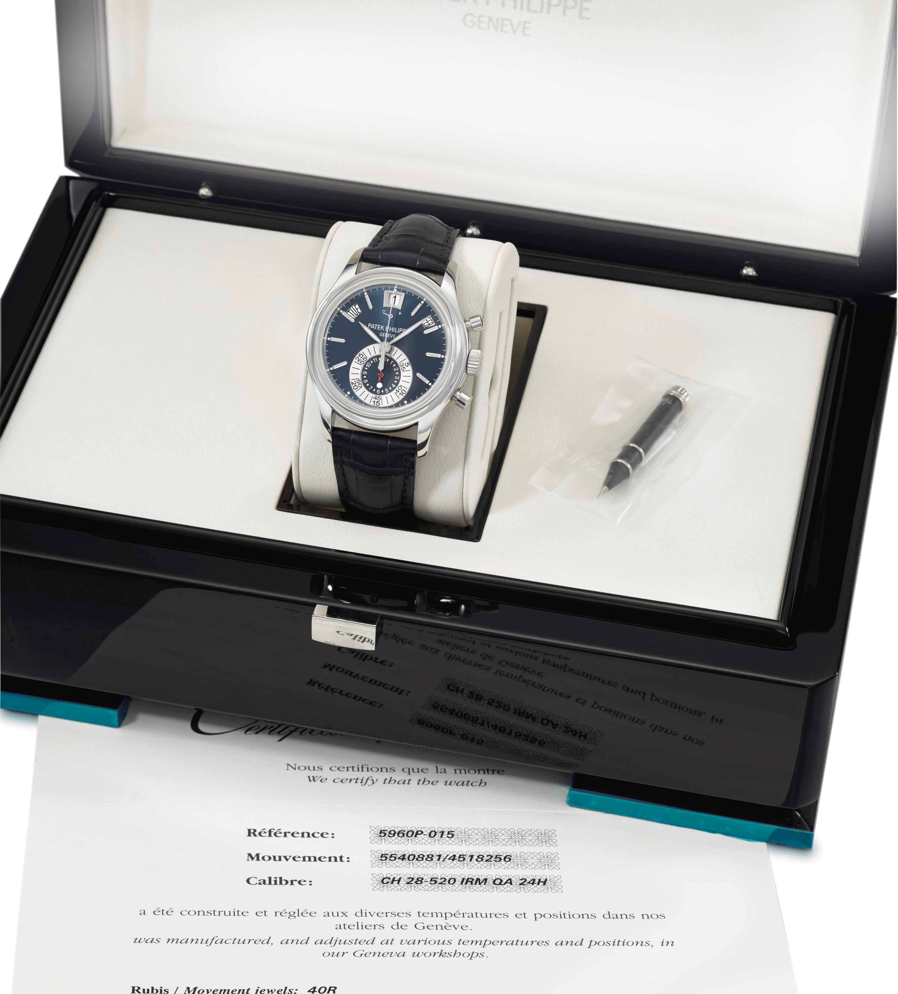 Patek Philippe. A fine, rare and very attractive platinum automatic chronograph wristwatch with annual calendar, day and night indication, power reserve indication, blue dial, Certificate and box