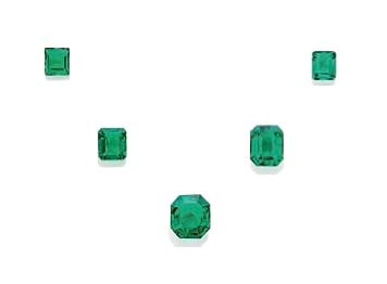FIVE UNMOUNTED EMERALDS