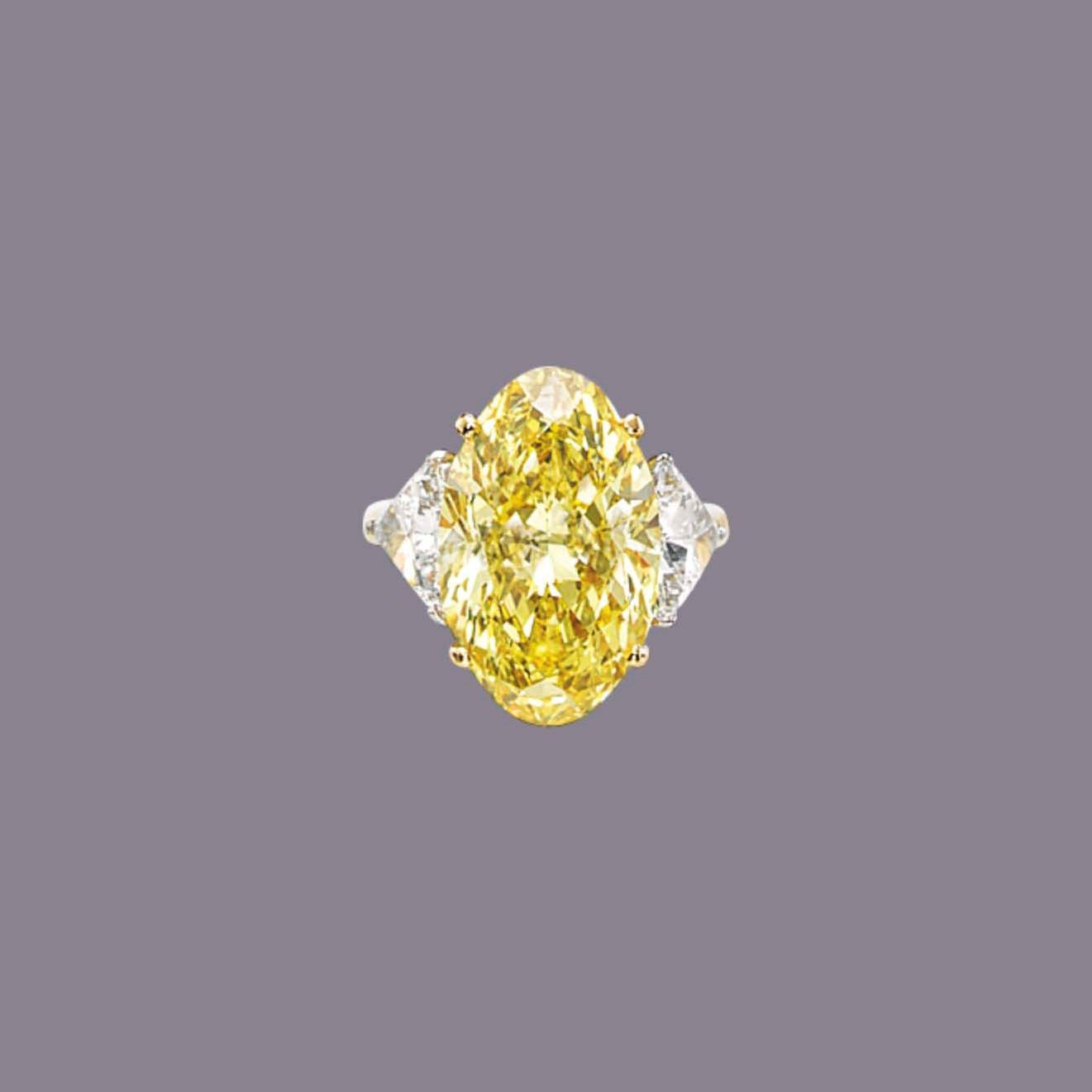 A COLOURED DIAMOND AND DIAMOND RING
