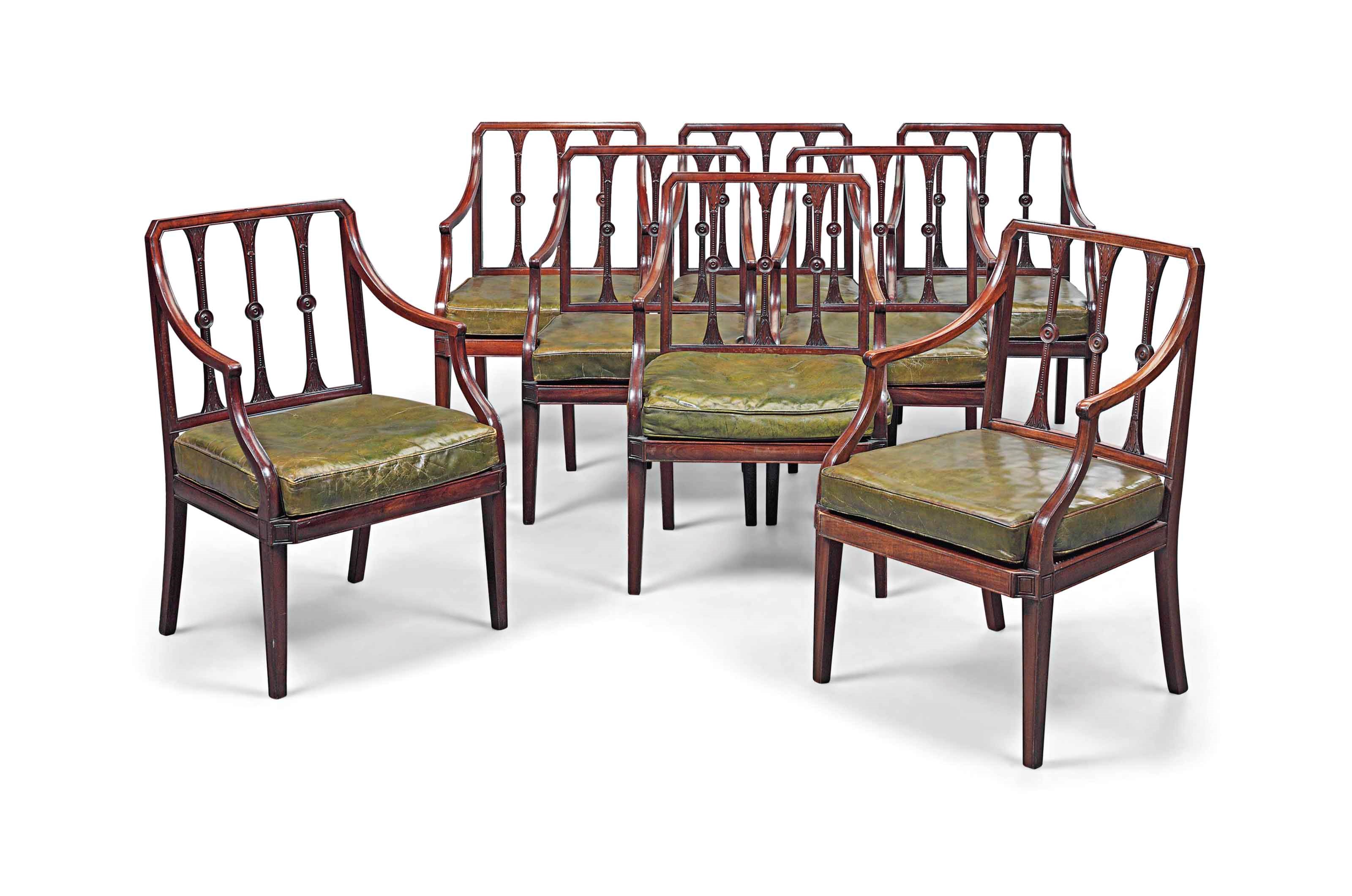 A SET OF EIGHT MAHOGANY OPEN ARMCHAIRS