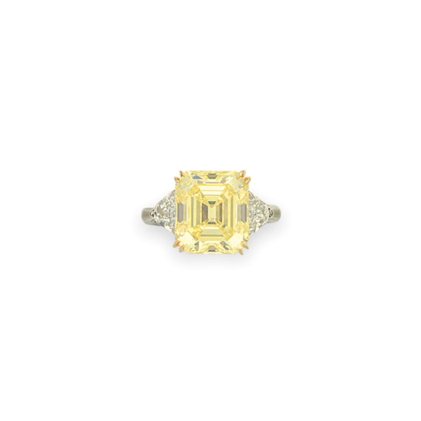 A COLORED DIAMOND AND DIAMOND RING