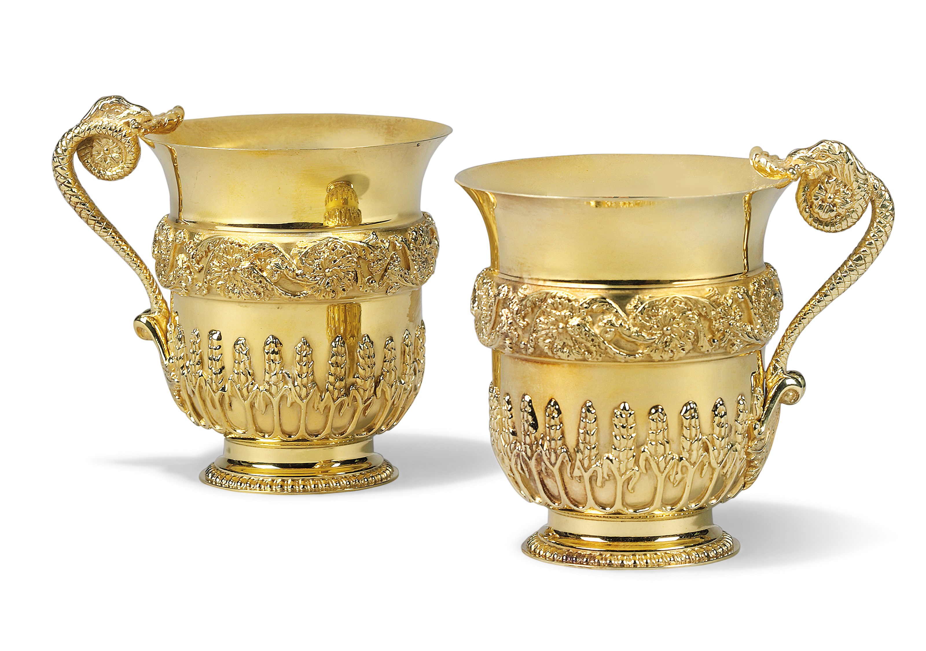 A PAIR OF MODERN SILVER-GILT MUGS AFTER THE MODEL FOR COLONEL PELHAM'S CUP BY WILLIAM KENT