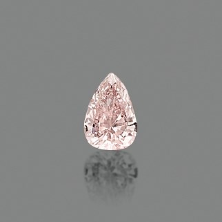AN UNMOUNTED COLOURED DIAMOND