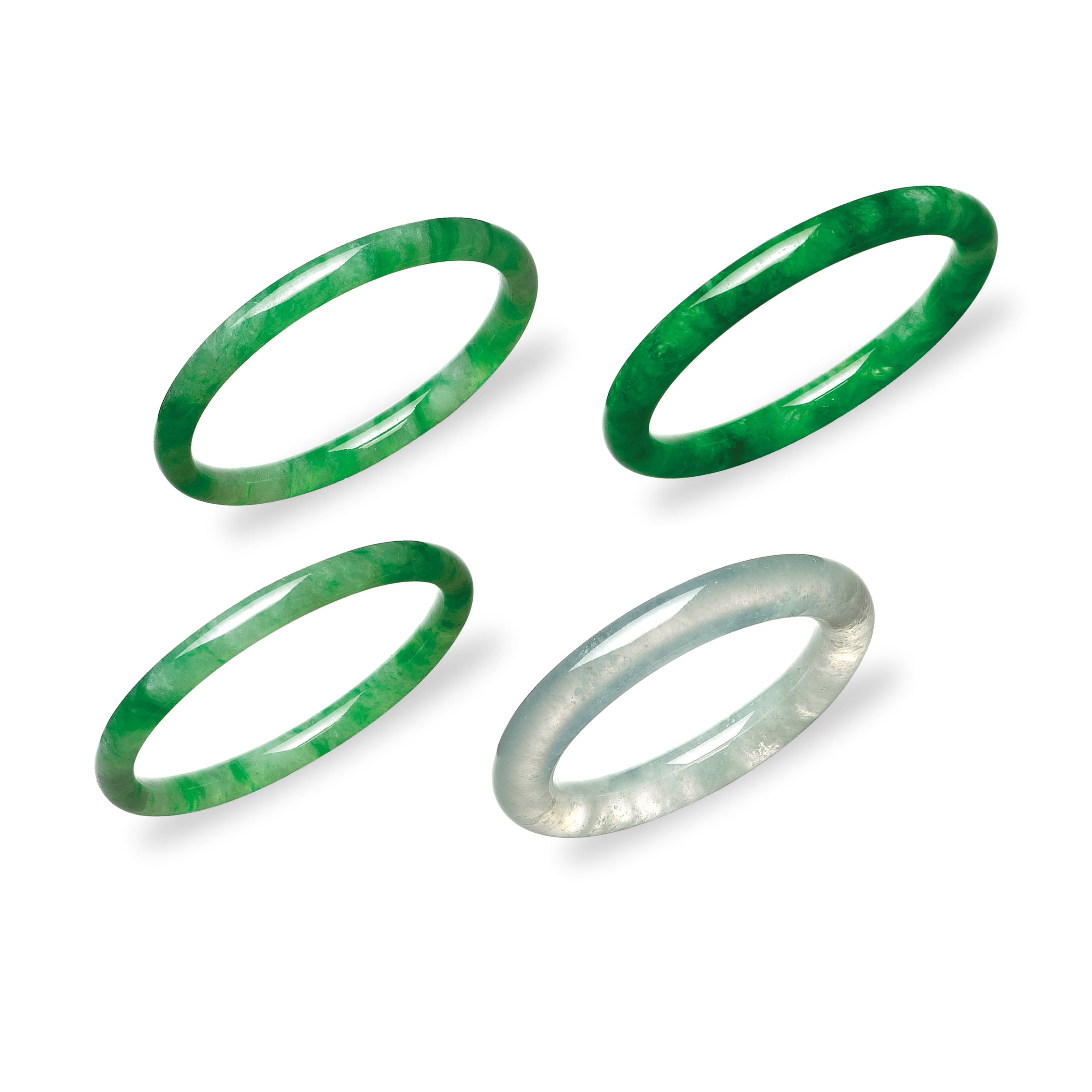 FOUR JADEITE BANGLES