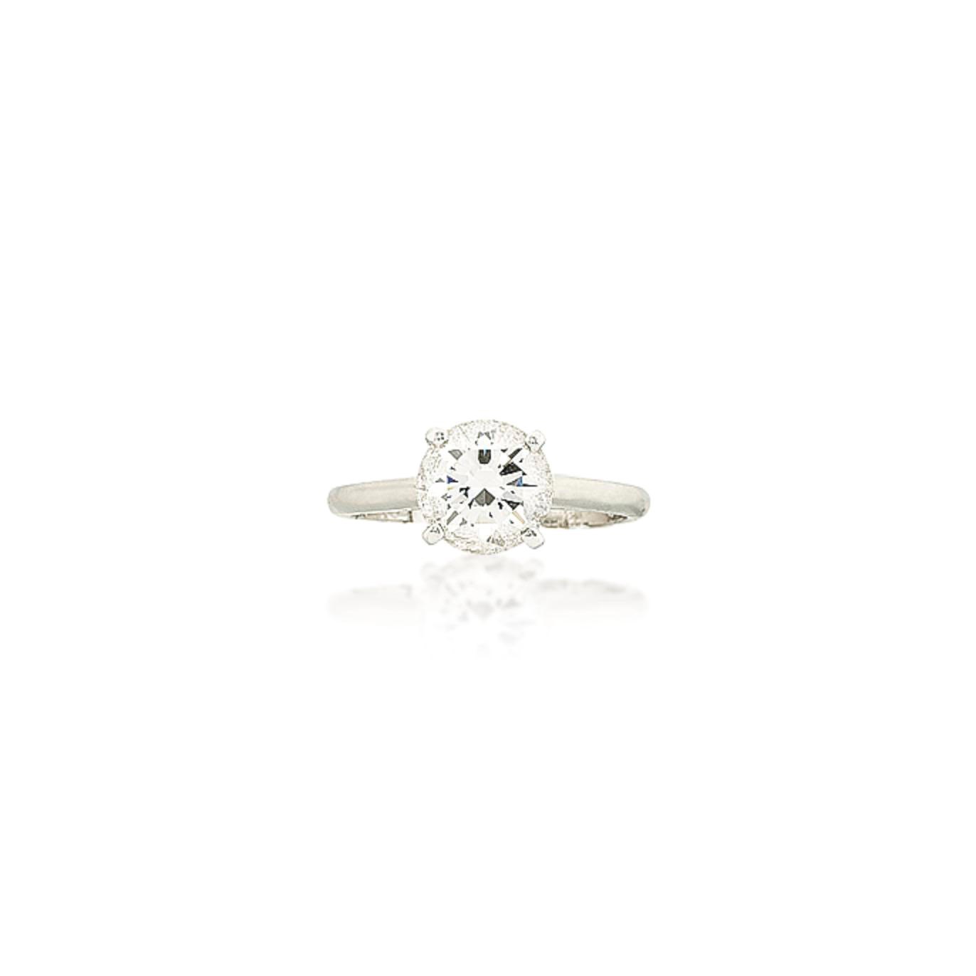 A PLATINUM AND DIAMOND RING, BY DEBEERS