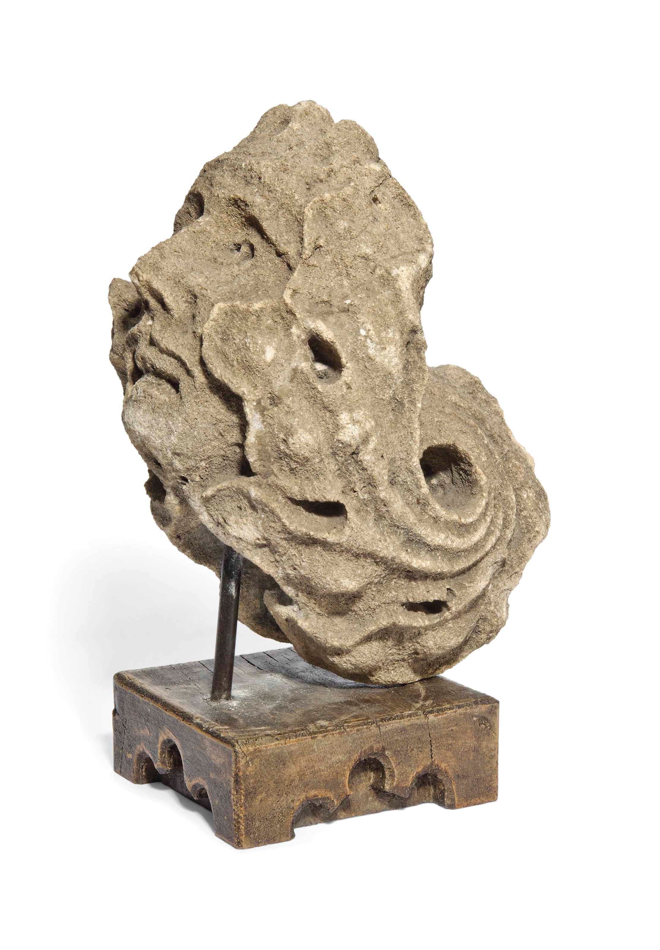 A MEDIEVAL LIMESTONE ARCHITECTURAL CORBEL BUST