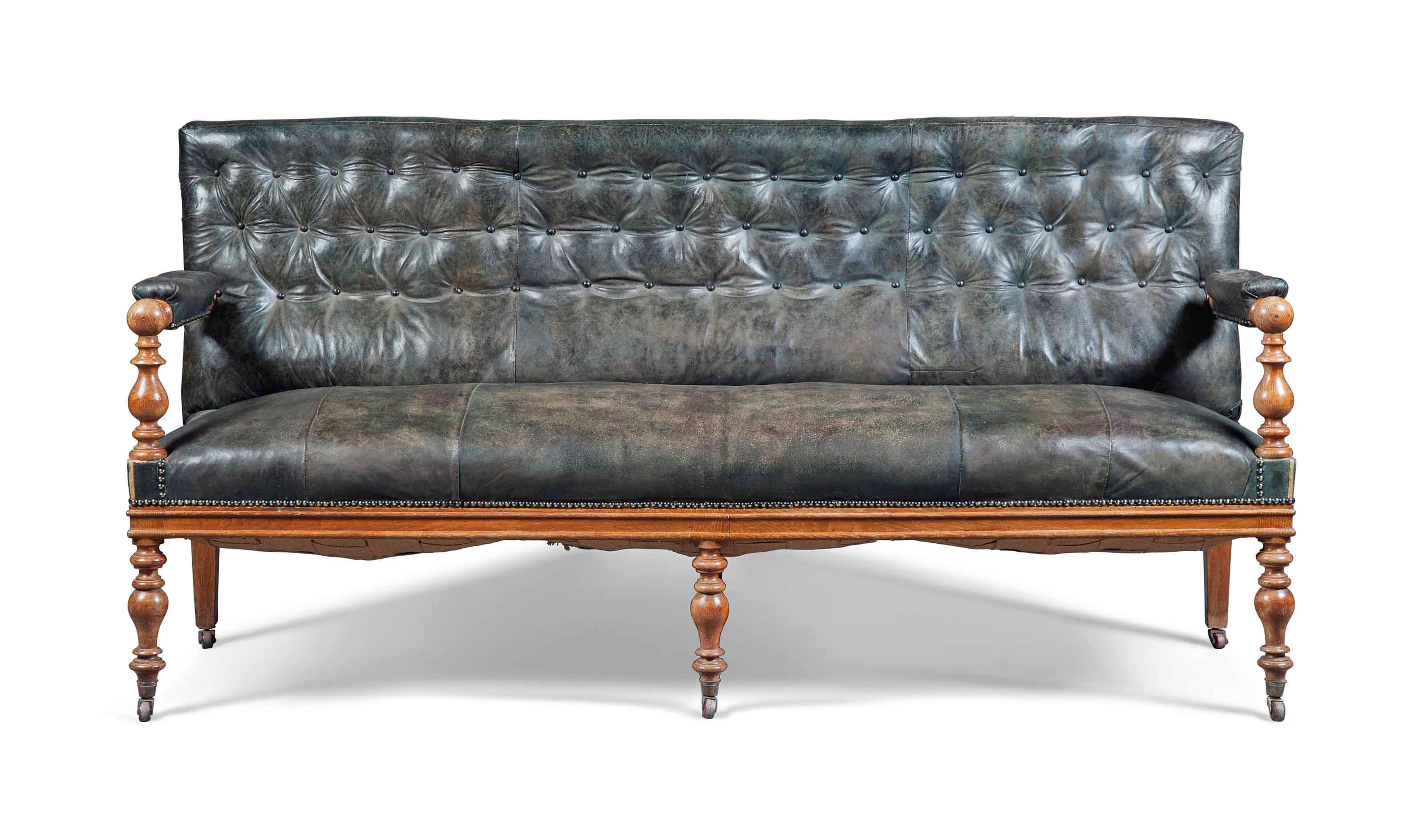 A VICTORIAN OAK SOFA