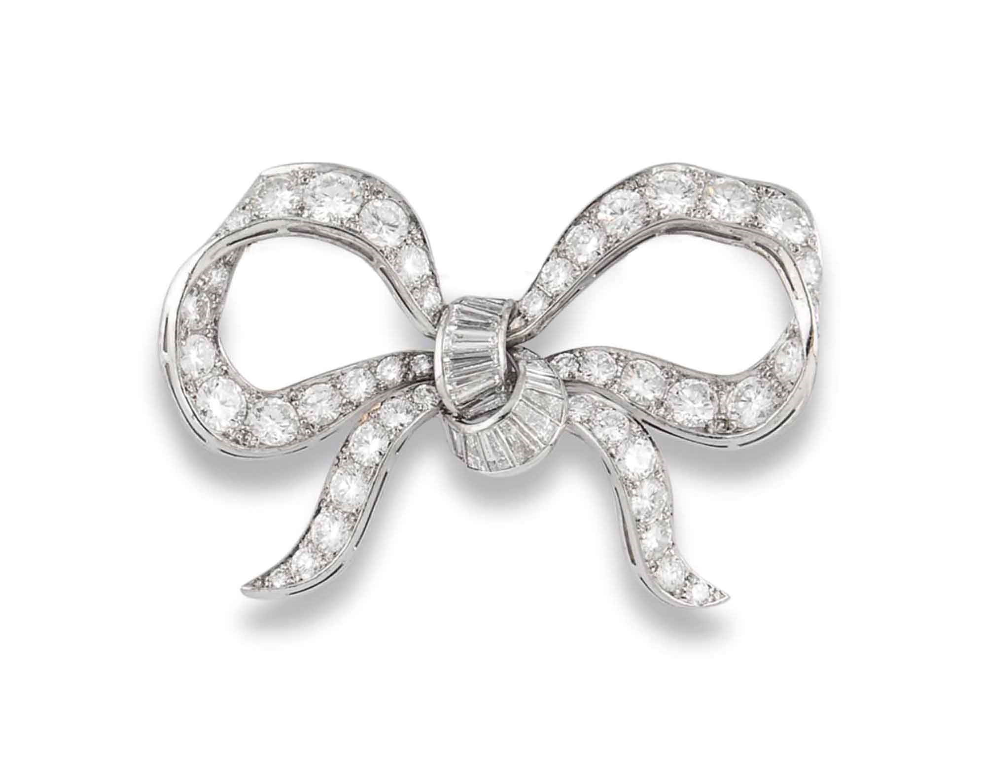A DIAMOND BOW BROOCH