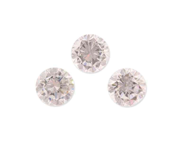 THREE UNMOUNTED DIAMONDS