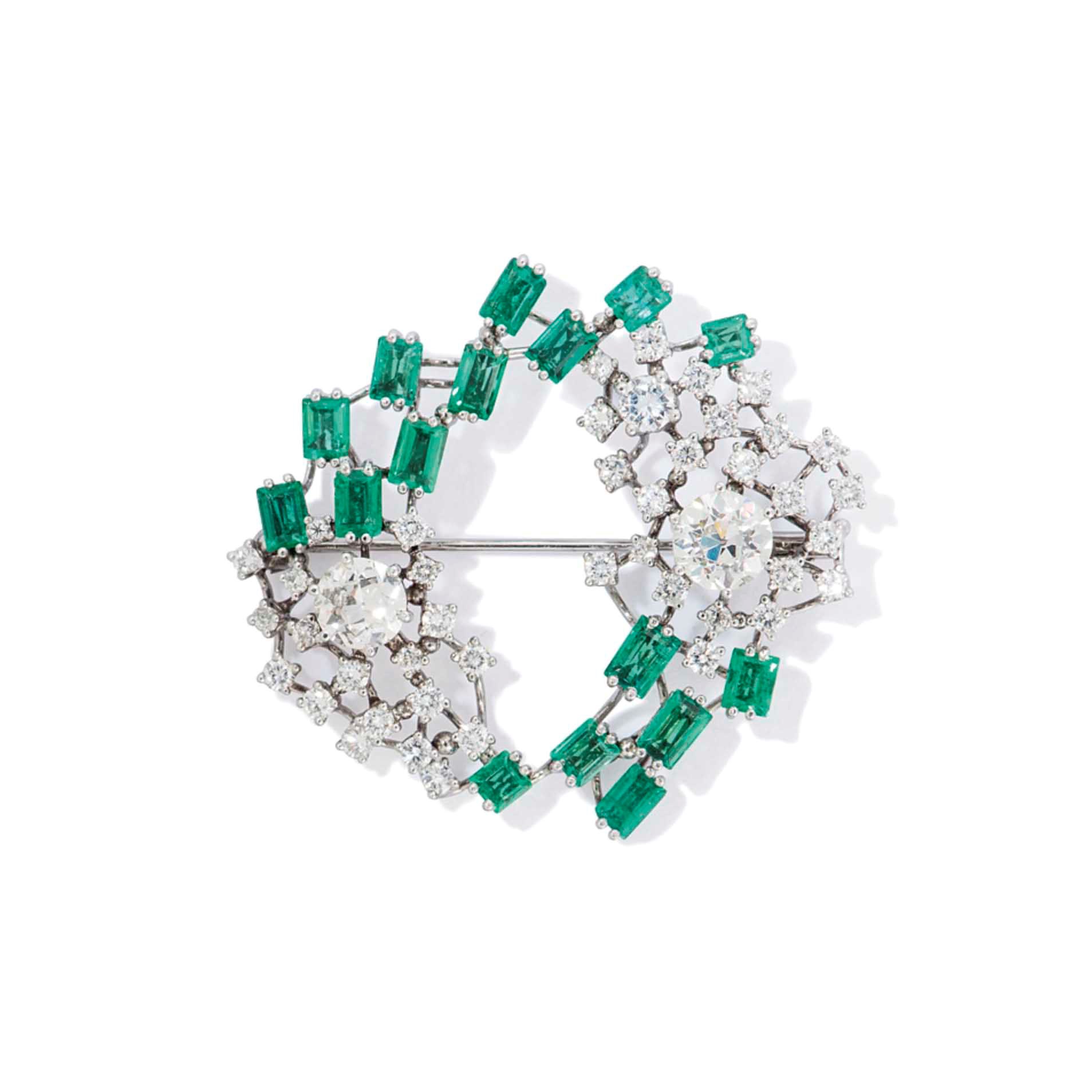 A DIAMOND AND EMERALD BROOCH