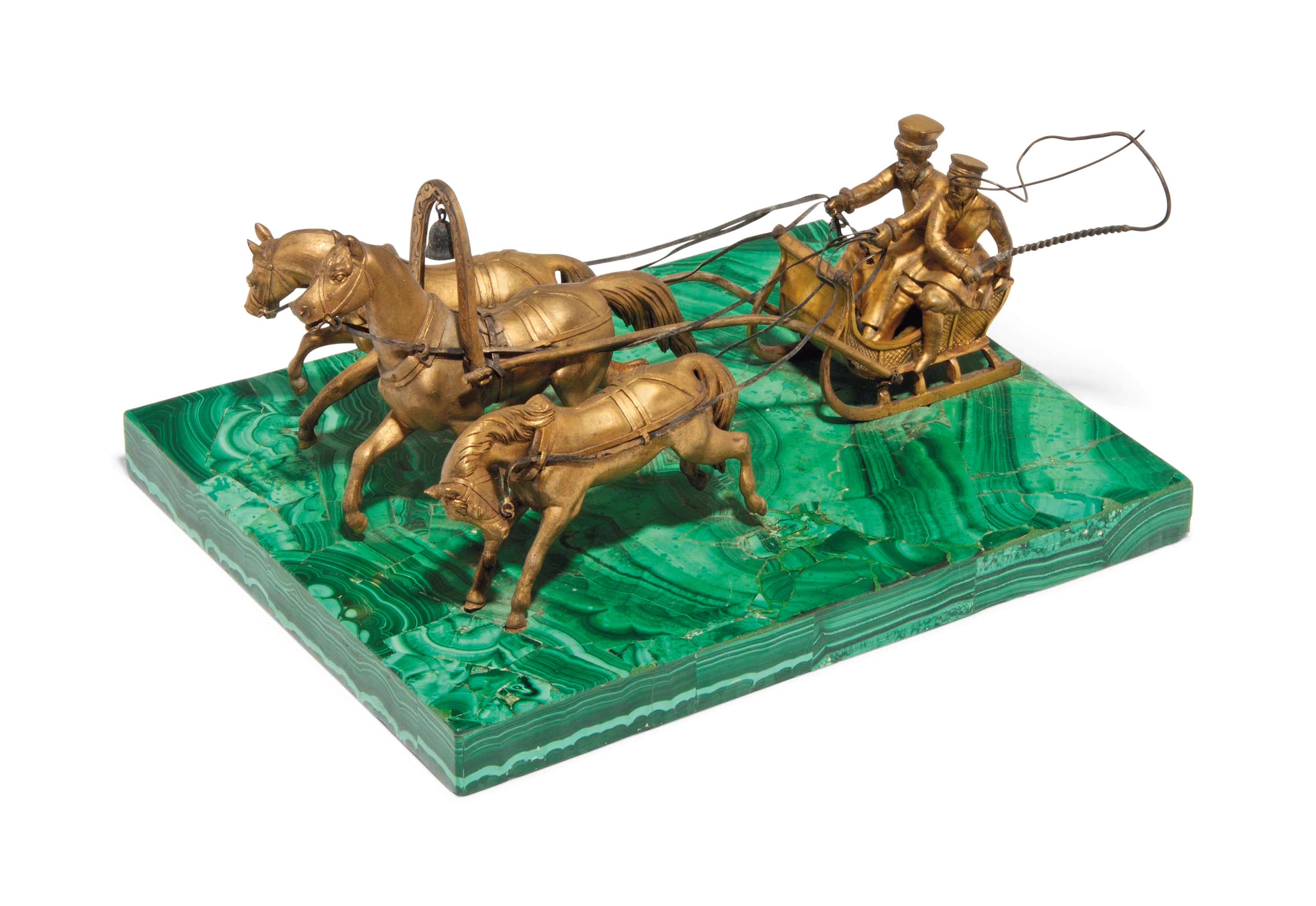 A RUSSIAN GILT-BRONZE AND MALACHITE TROIKA GROUP