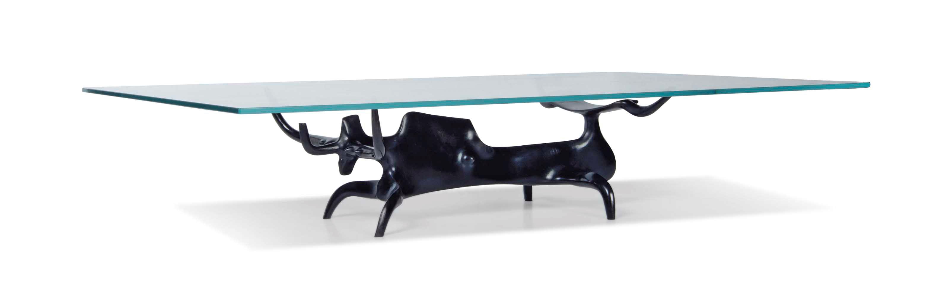 A VICTOR ROMAN(1937-1995) PATINATED BRONZE AND GLASS 'TAUREAU' COFFEE TABLE