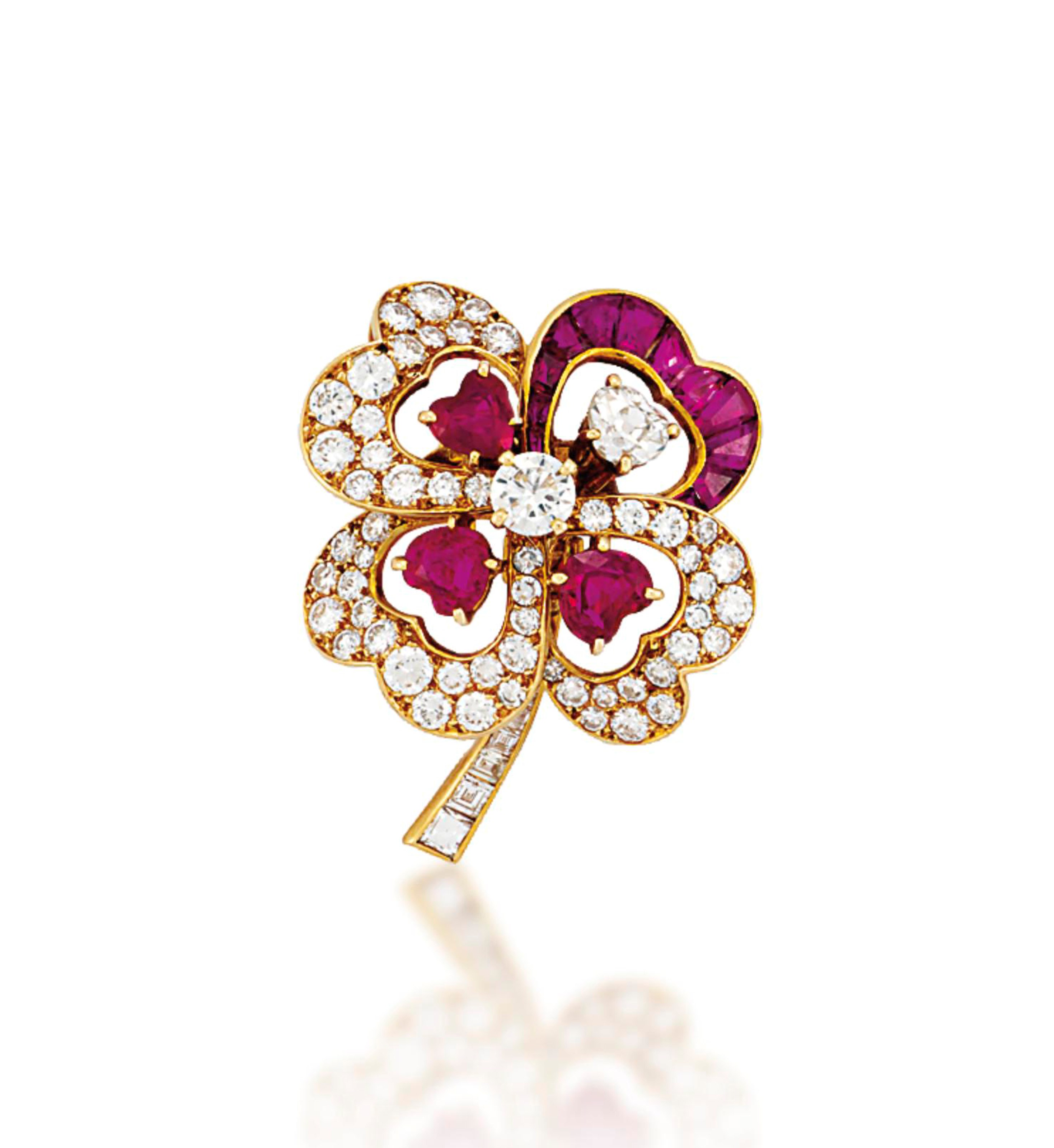 A RUBY AND DIAMOND CLIP BROOCH, BY CARTIER