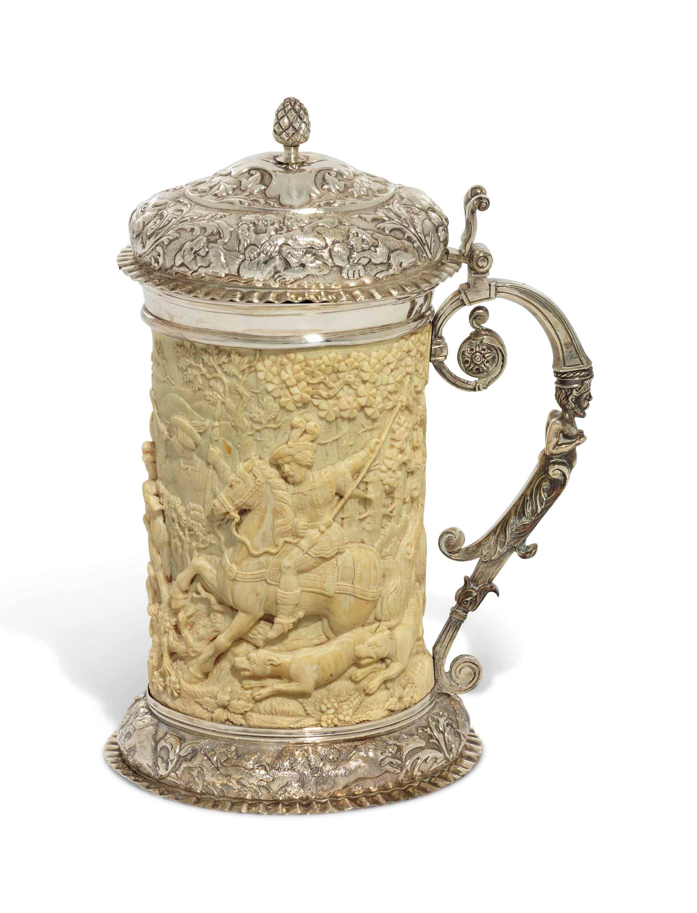 A GERMAN SILVER-MOUNTED CARVED IVORY TANKARD