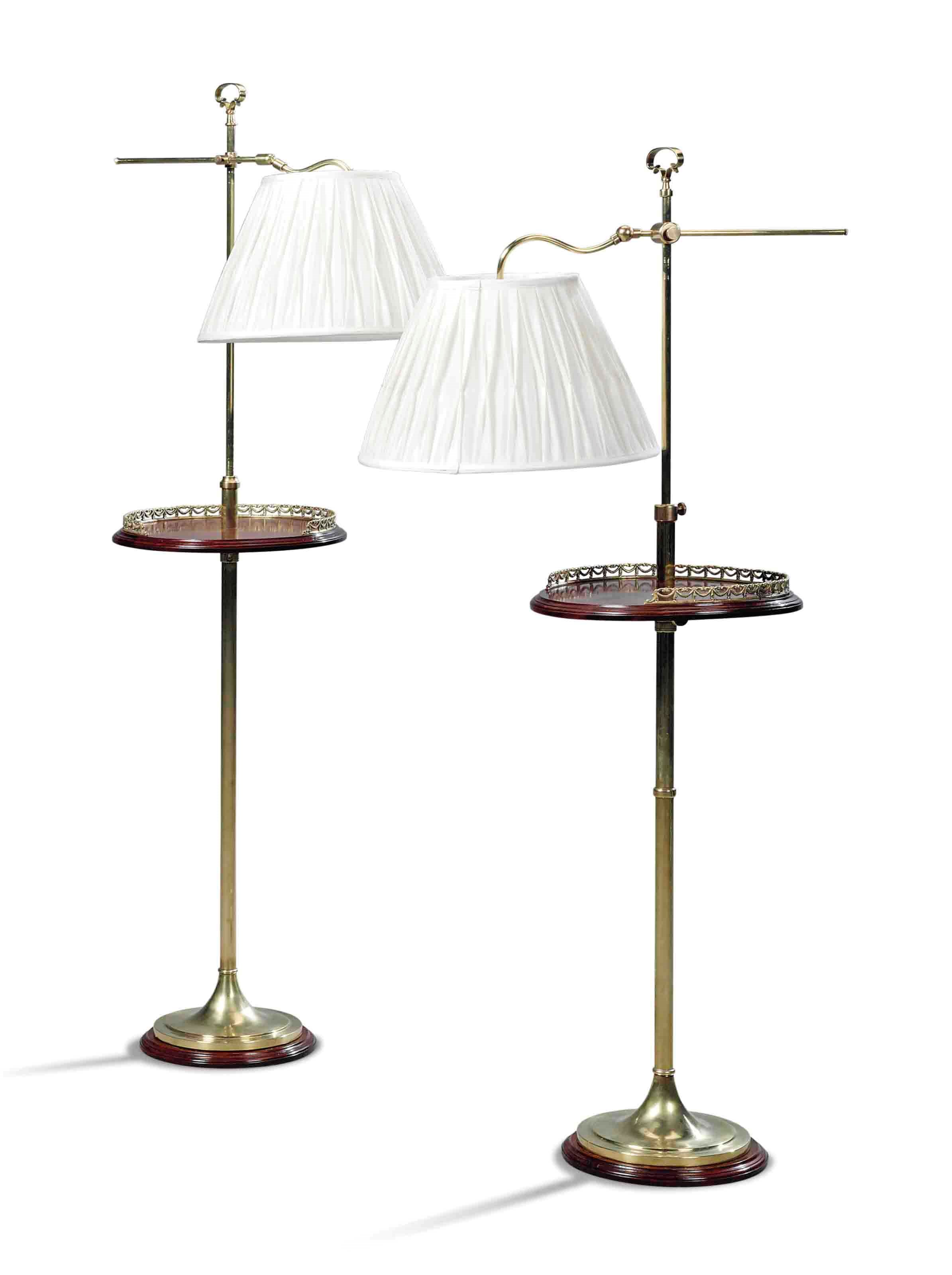 A PAIR OF BRASS AND MAHOGANY ADJUSTABLE STANDARD LAMPS