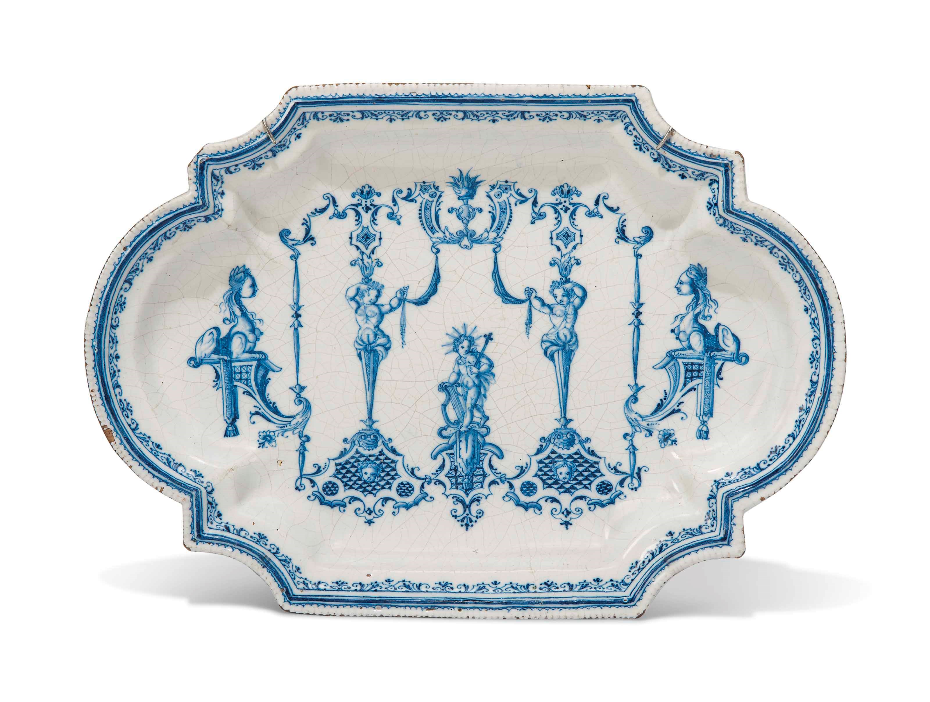 A CONTINENTAL FAIENCE BLUE AND WHITE SHAPED-RECTANGULAR DISH