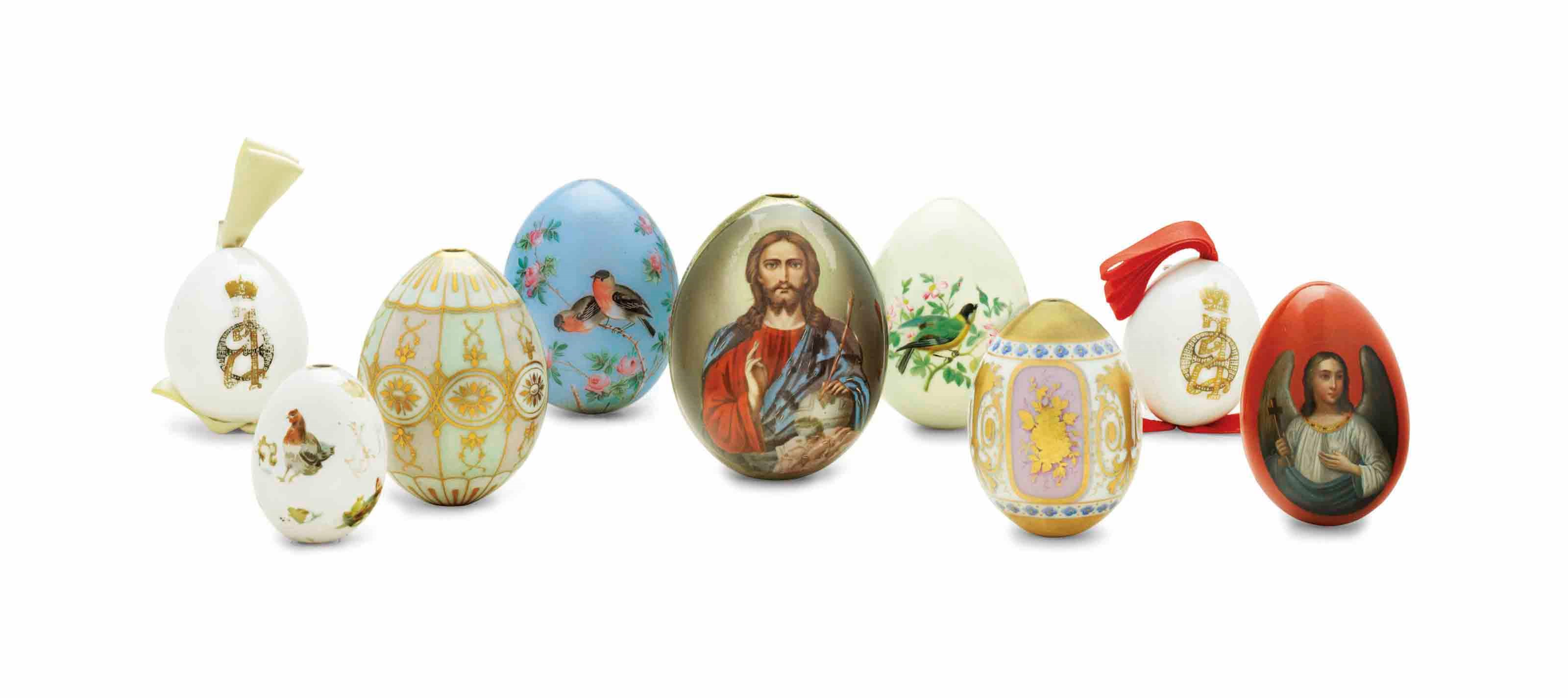 A GROUP OF NINE PORCELAIN AND LACQUERED PAPIER-MACHÉ EASTER EGGS