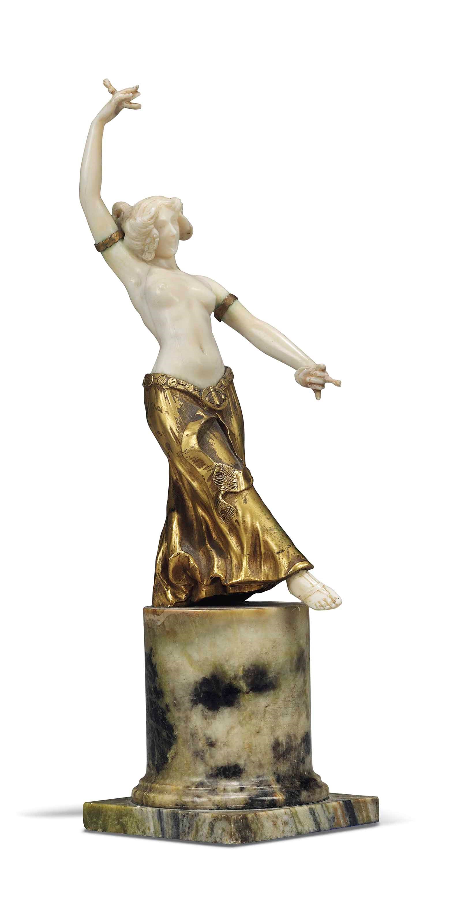 A GILT-BRONZE AND IVORY FIGURE OF A 'CASTERNET' DANCER