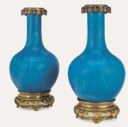 A PAIR OF ORMOLU-MOUNTED THEODORE DECK FAIENCE 'PERSIAN-BLUE' GROUND VASES, MOUNTED AS LAMPS