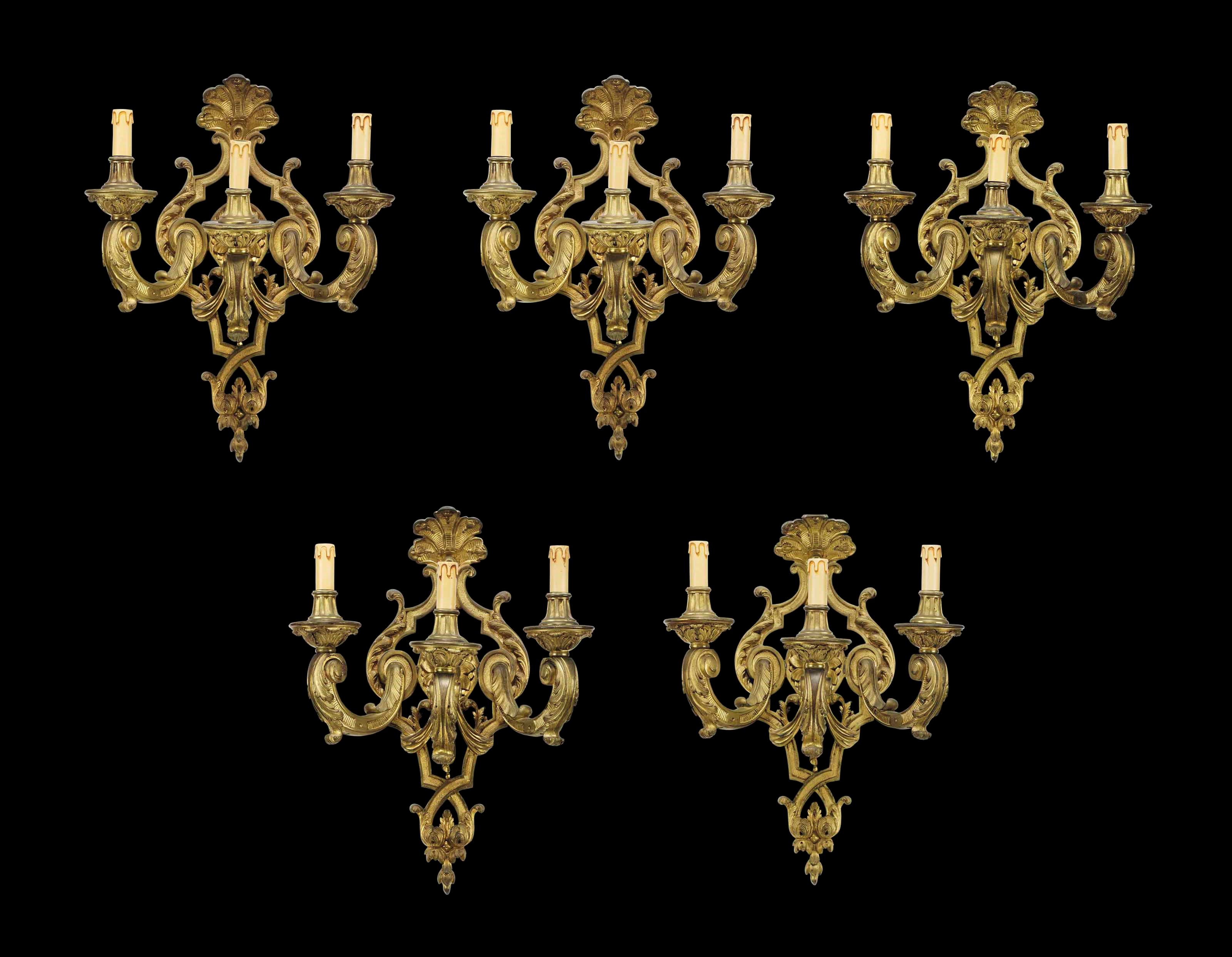 A SET OF FIVE FRENCH ORMOLU THREE-LIGHT WALL-APPLIQUES