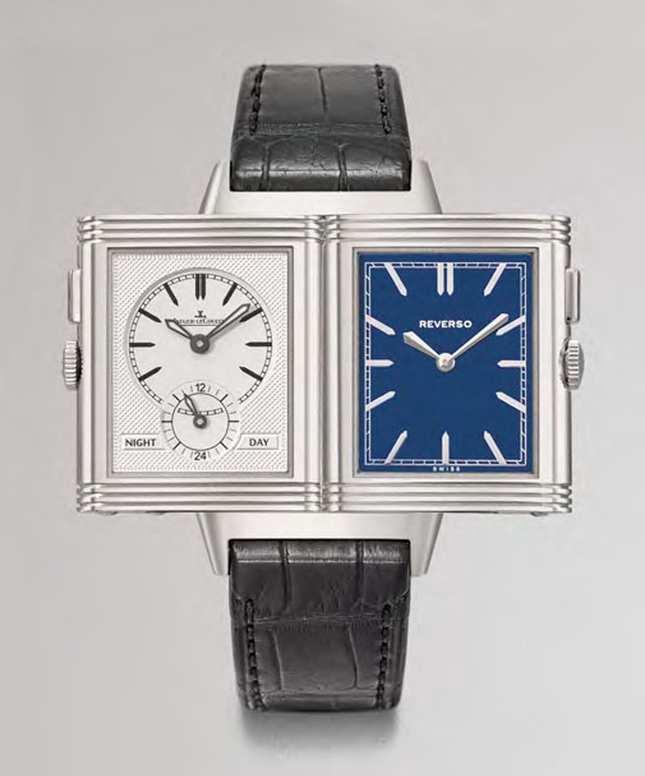 Jaeger-LeCoultre. A fine stainless steel rectangular special edition reversible dual time zone wristwatch with day and night indication and blue lacquer dial, original guarantee and box