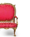 A GEORGE II MAHOGANY AND PARCEL-GILT SOFA