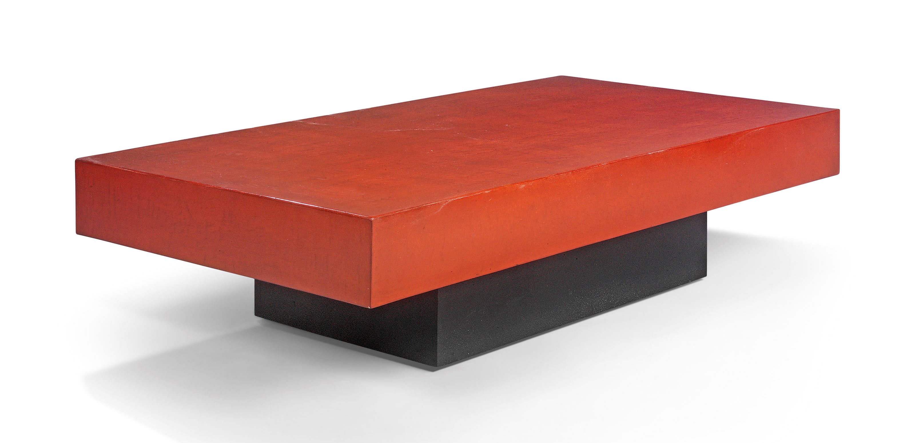 A MODERN RED LACQUERED LOW TABLE