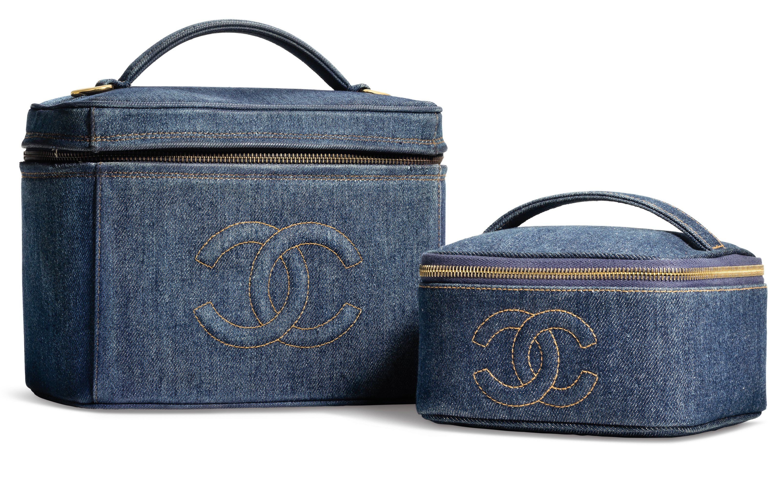 A SET OF TWO:A SMALL BLUE DENIM VANITY CASE WITH GOLD HARDWAREA LARGE BLUE DENIM VANITY CASE WITH GOLD HARDWARE