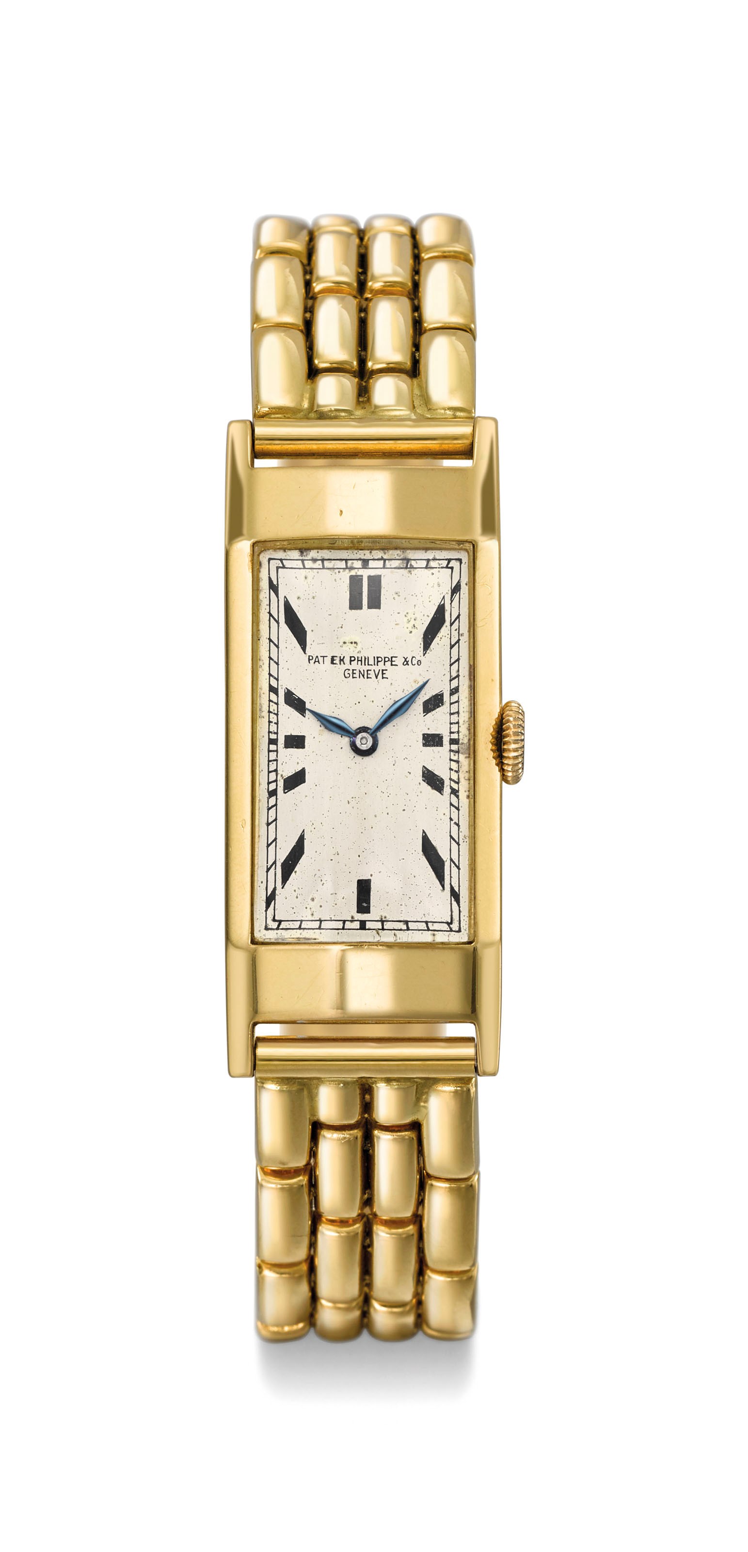 Patek Philippe. A rare and unusual 18K gold rectangular facetted wristwatch