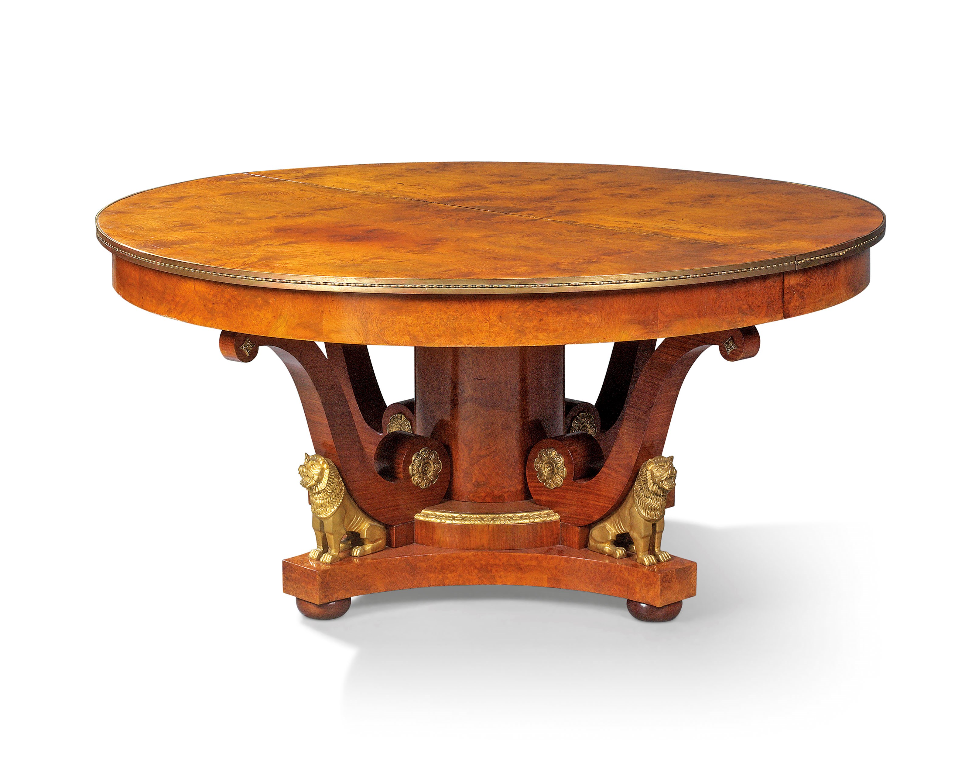 A FRENCH ORMOLU-MOUNTED AMBOYNA EXTENDABLE DINING-TABLE