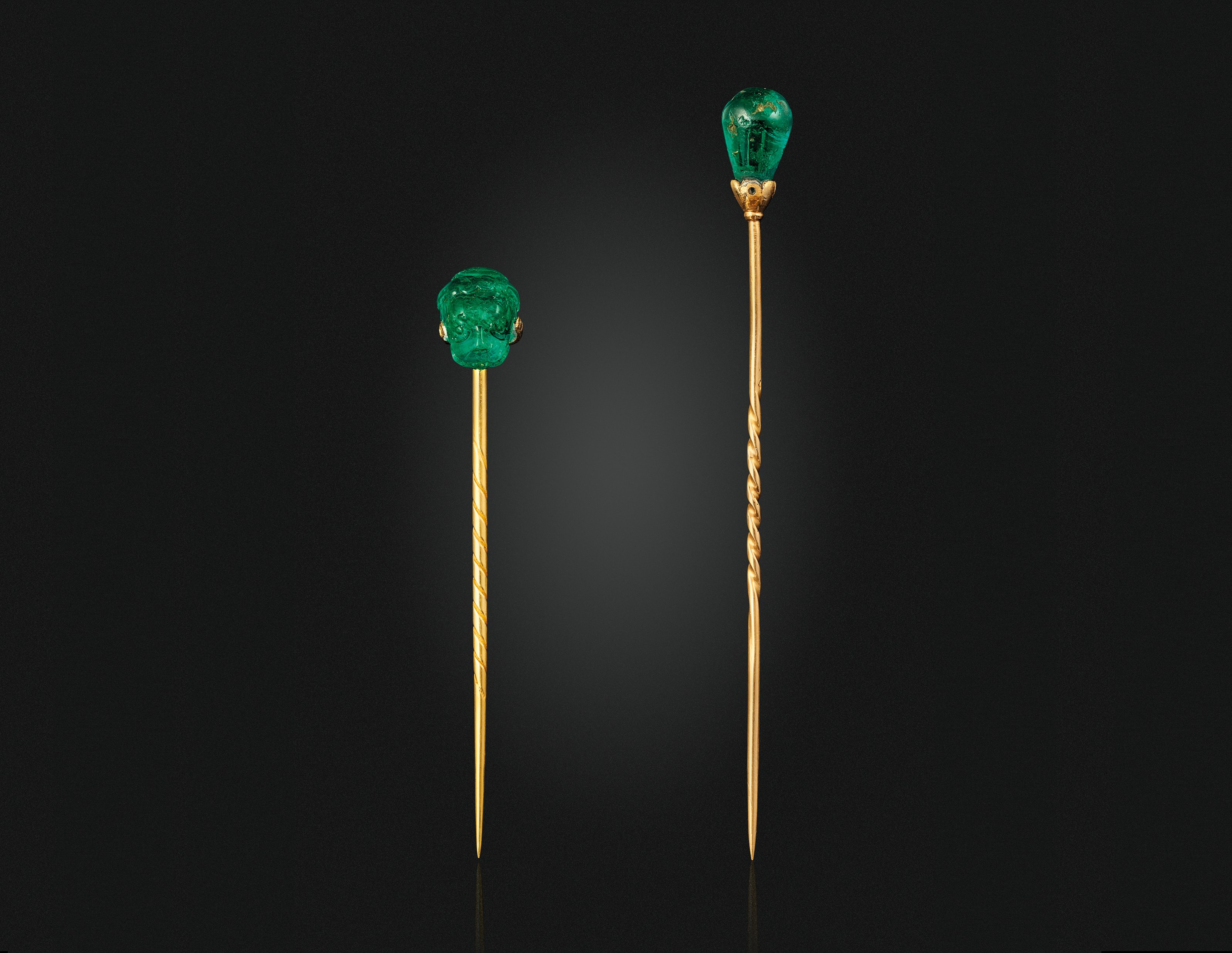 TWO EMERALD PINS