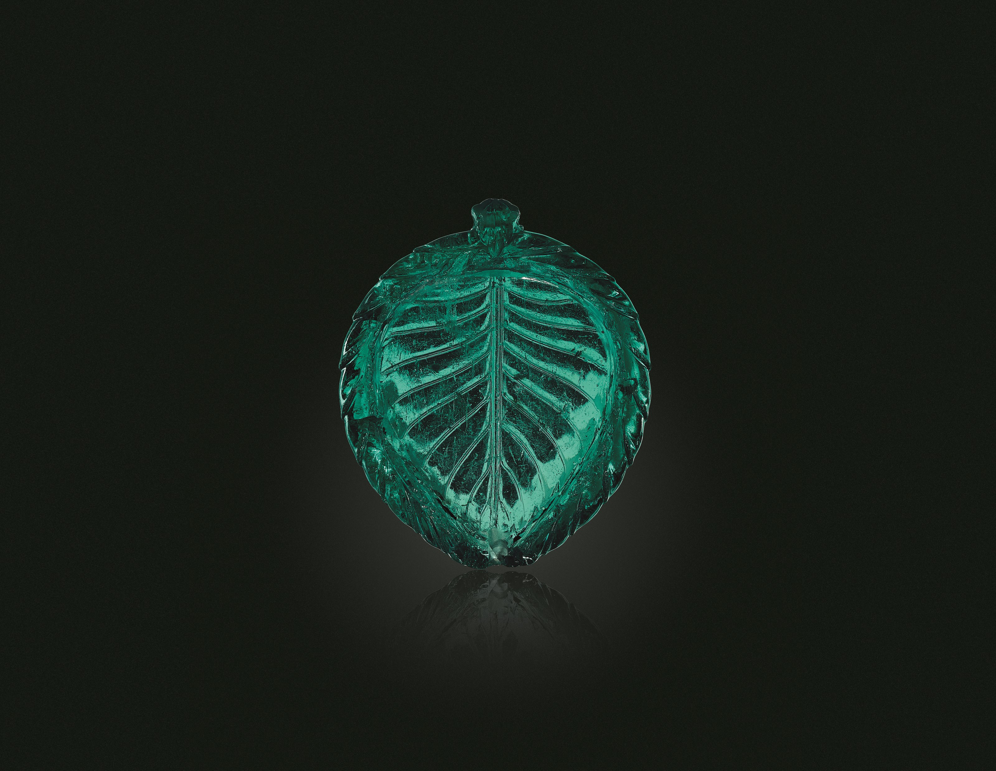 A CARVED EMERALD