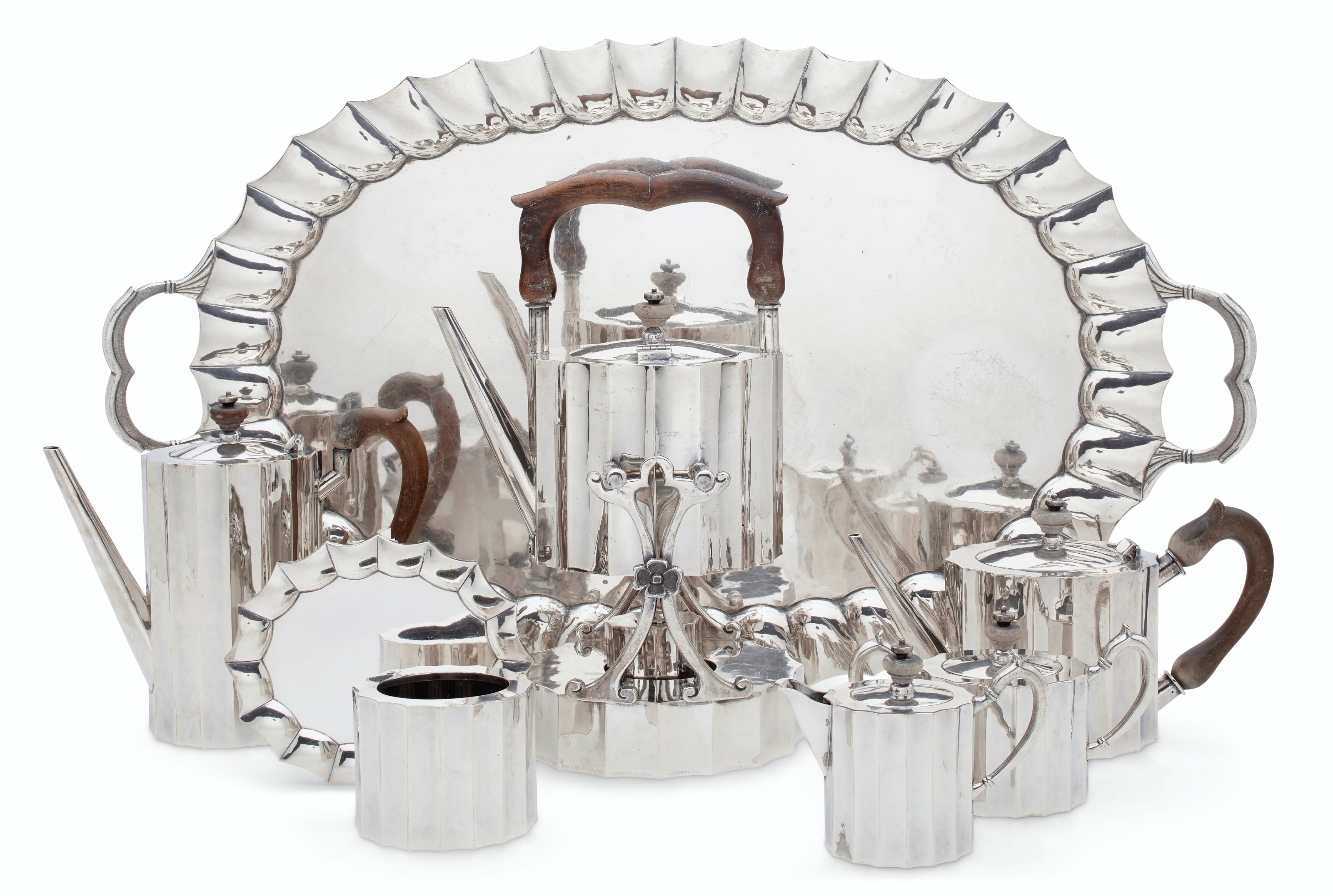 A SILVER SEVEN-PIECE TEA SERVICE AND TRAY
